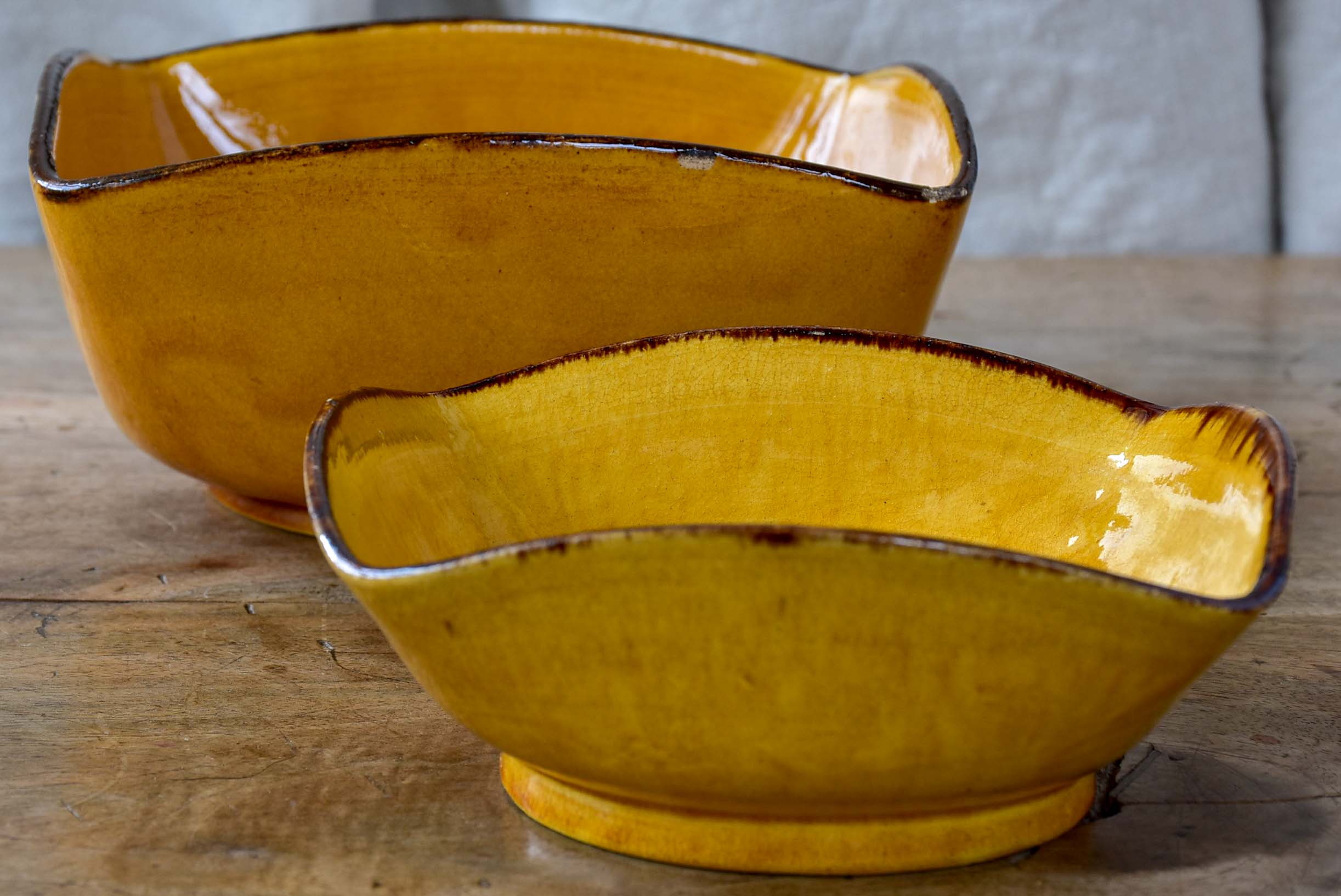 Two vintage Dieulefit bowls with ochre glaze