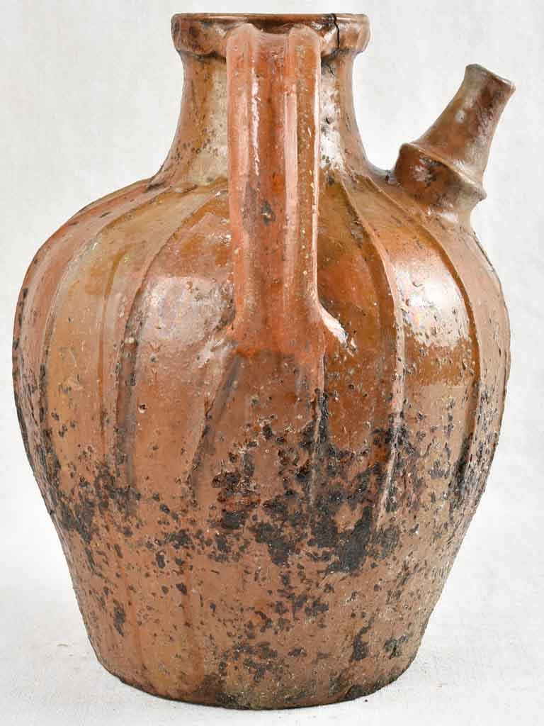 Antique French terracotta walnut oil pitcher from the Auvergne 14¼"
