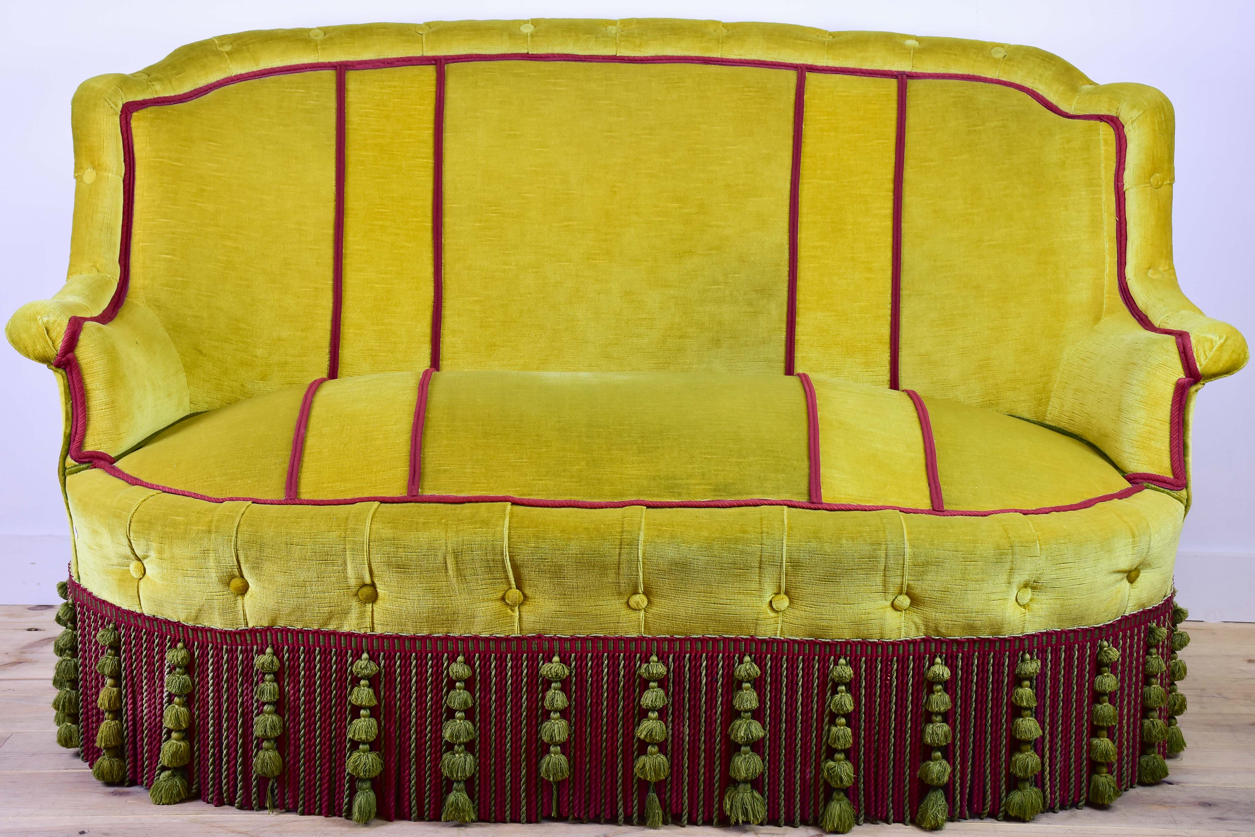Naooleon III sofa with yellow and pink upholstery and fringe