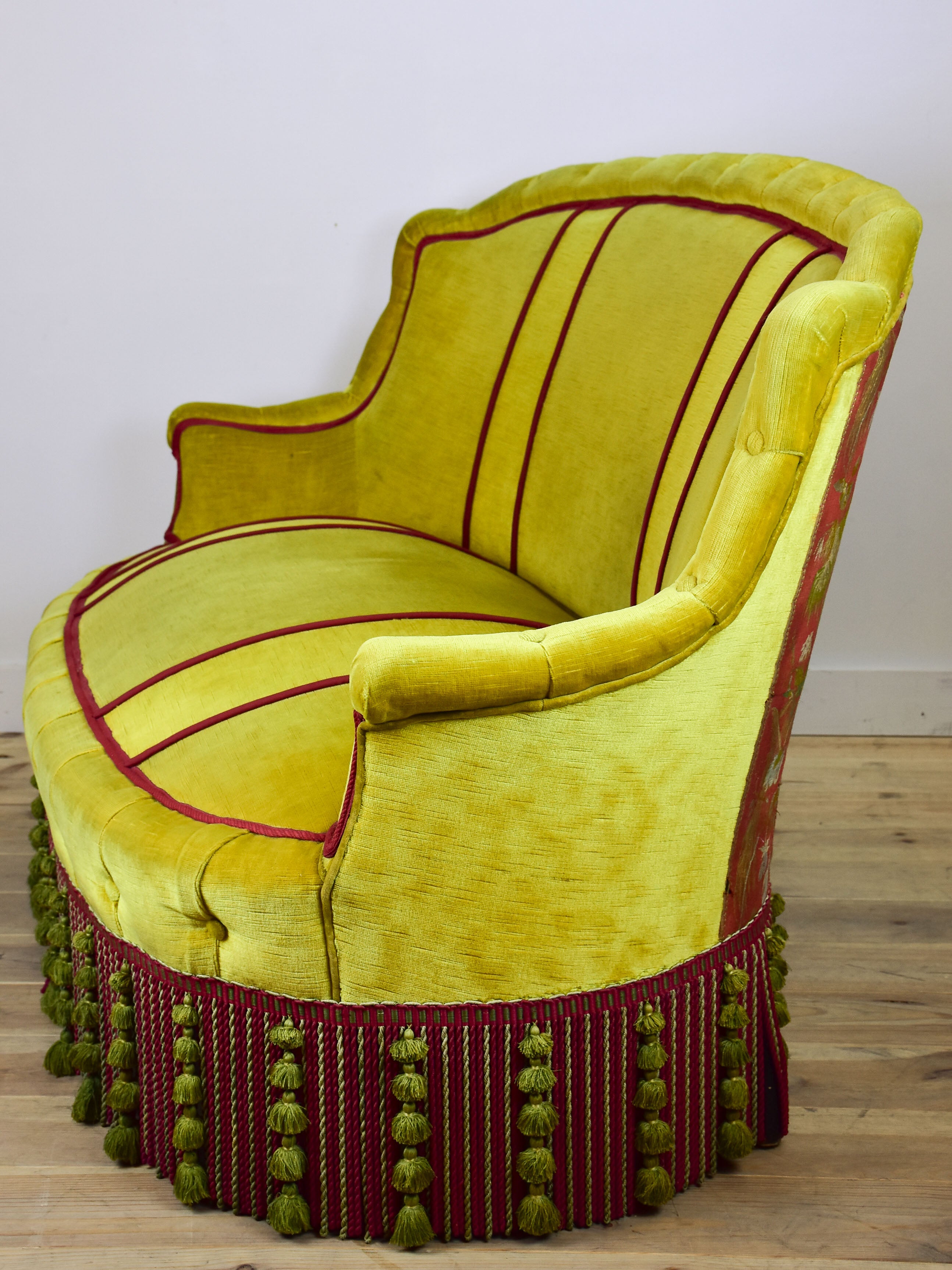 Naooleon III sofa with yellow and pink upholstery and fringe