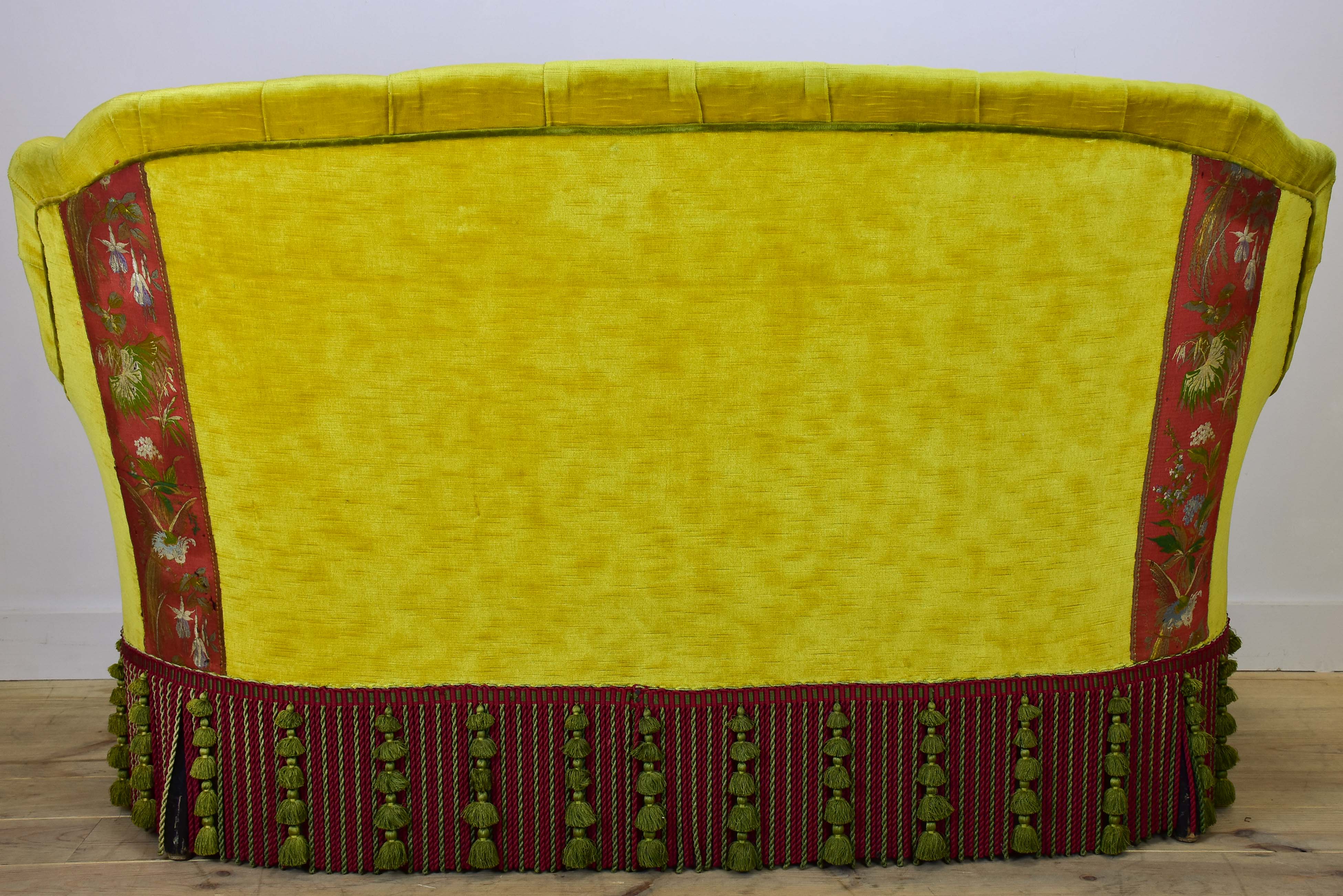 Naooleon III sofa with yellow and pink upholstery and fringe