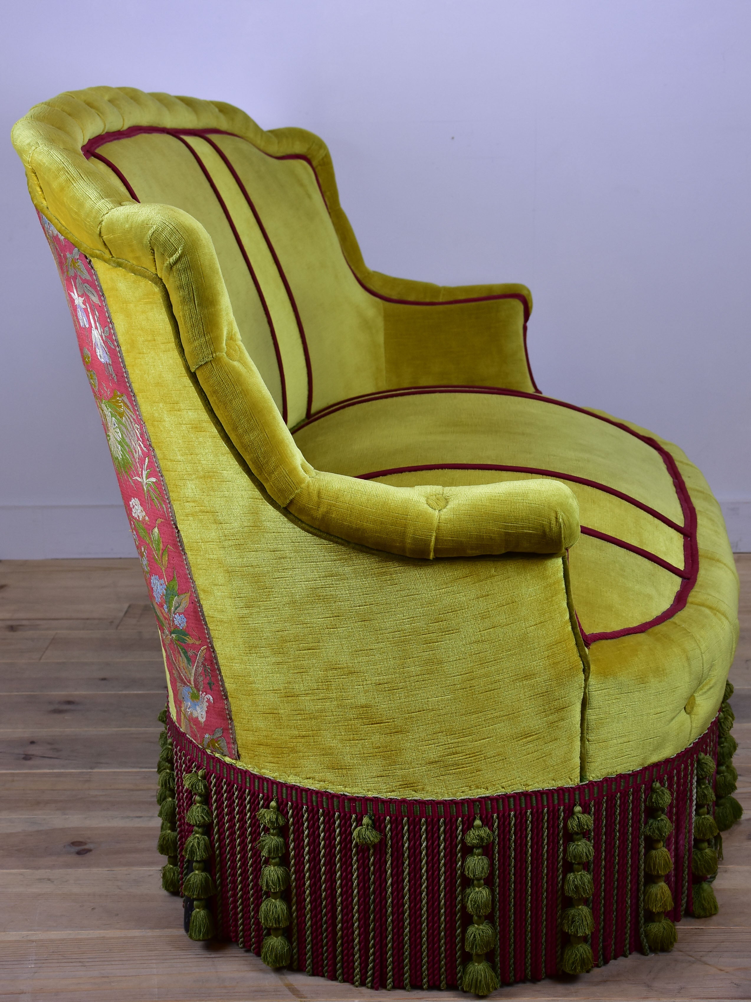 Naooleon III sofa with yellow and pink upholstery and fringe