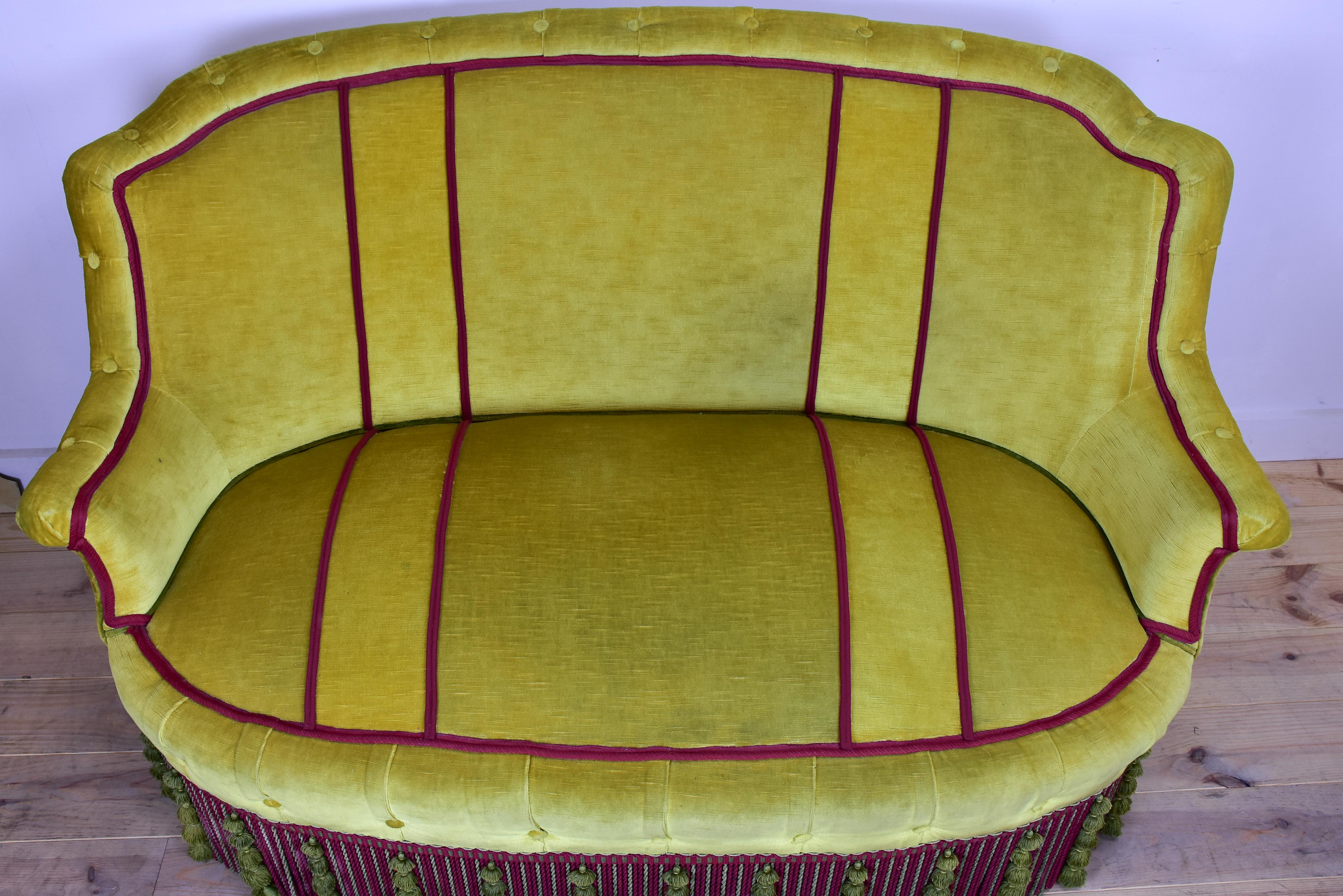 Naooleon III sofa with yellow and pink upholstery and fringe