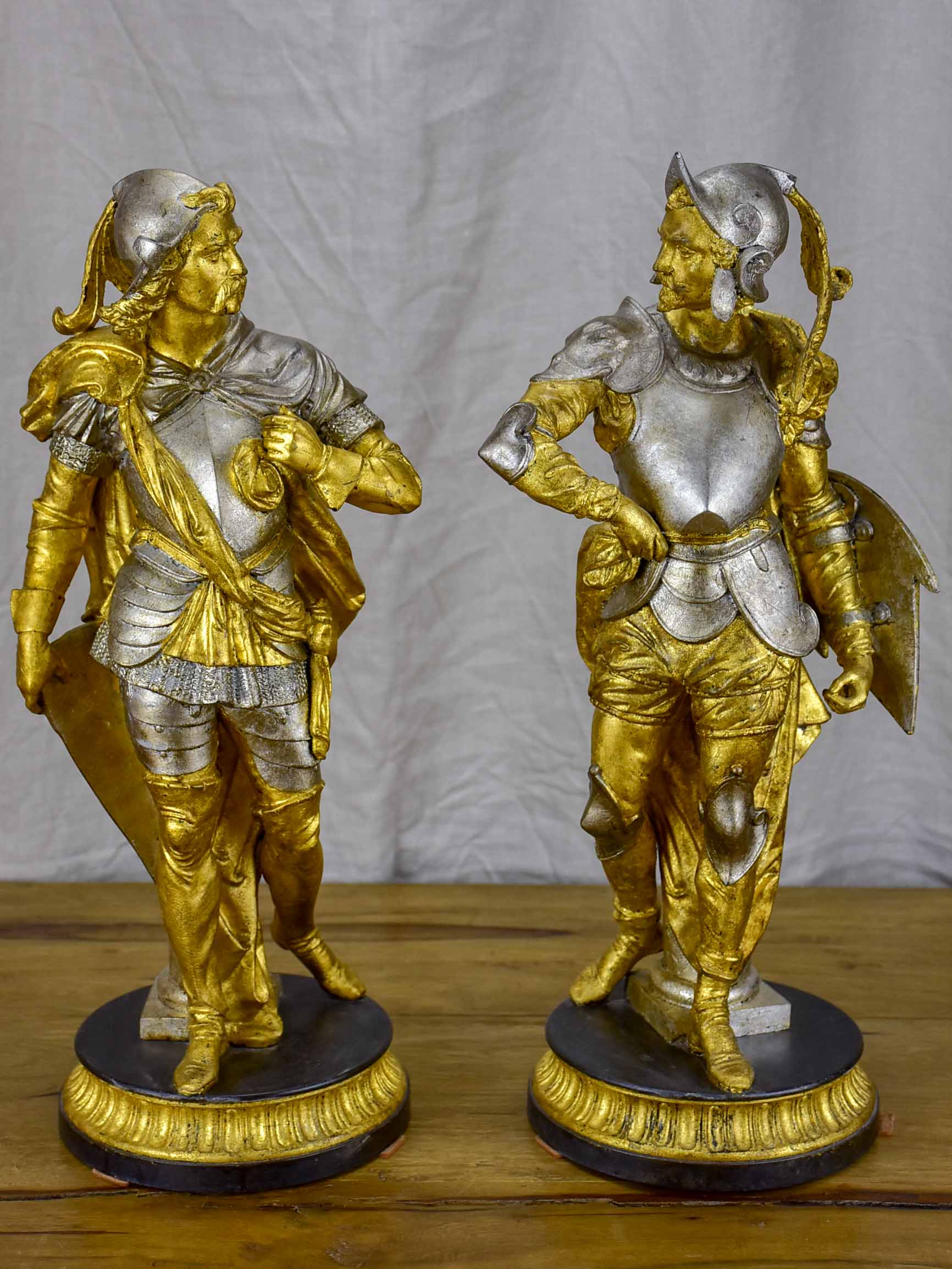 Pair of late 19th Century silver and gold statues