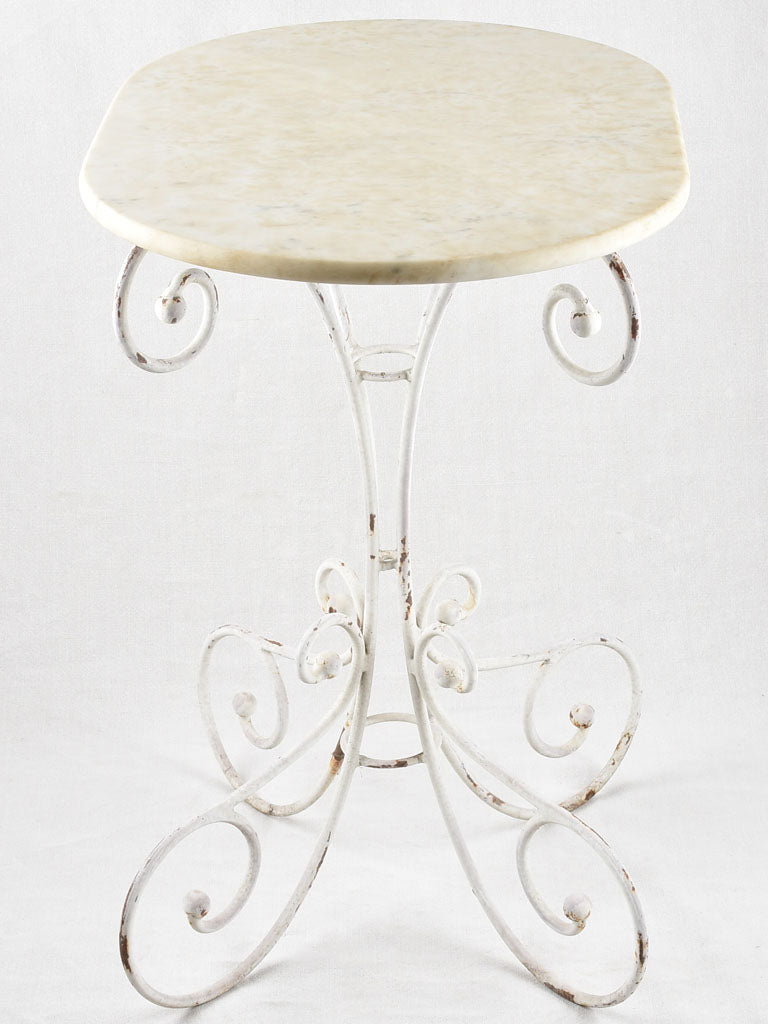 Oval marble garden table with wrought iron base 19¼" x 27½"