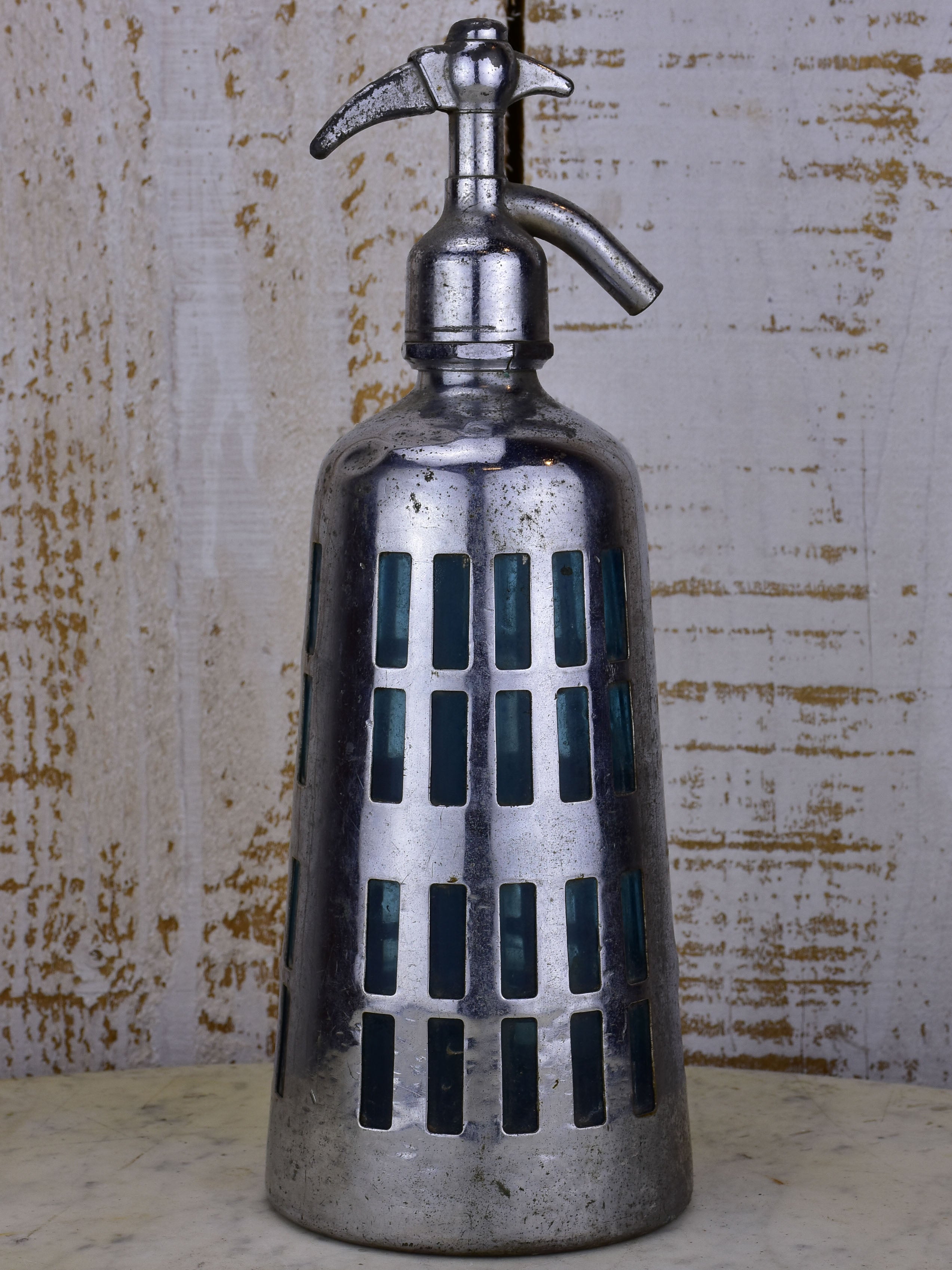Antique French Seltzer bottle with metal casing