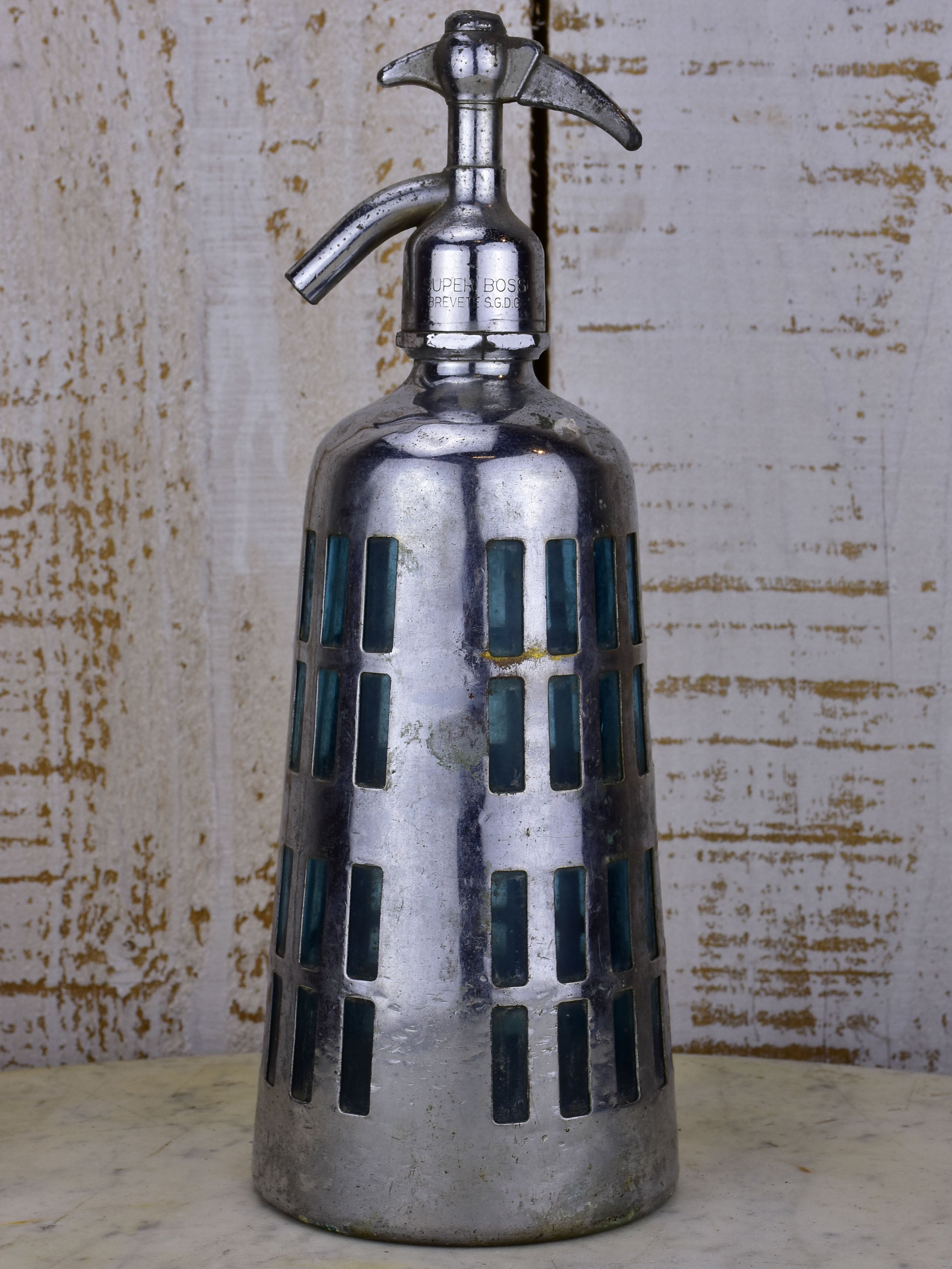 Antique French Seltzer bottle with metal casing