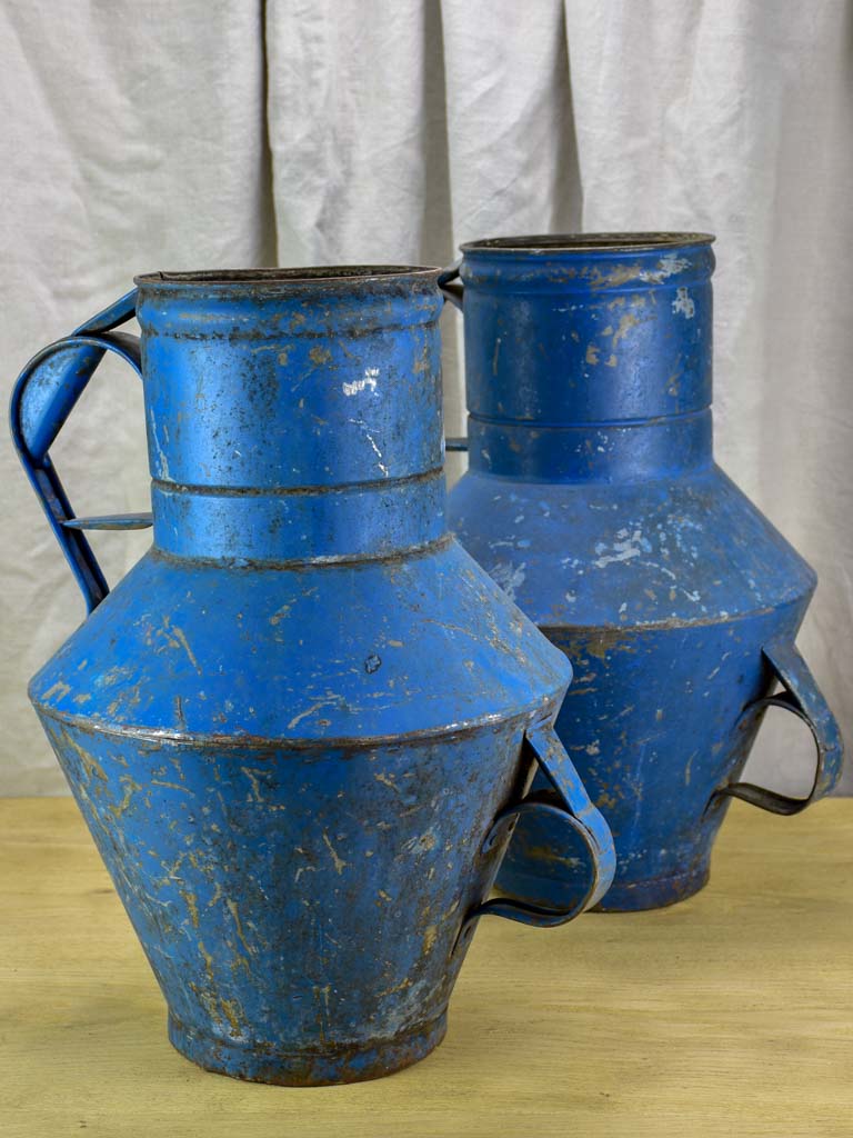 Pair of rustic blue agricultural vessels 20"