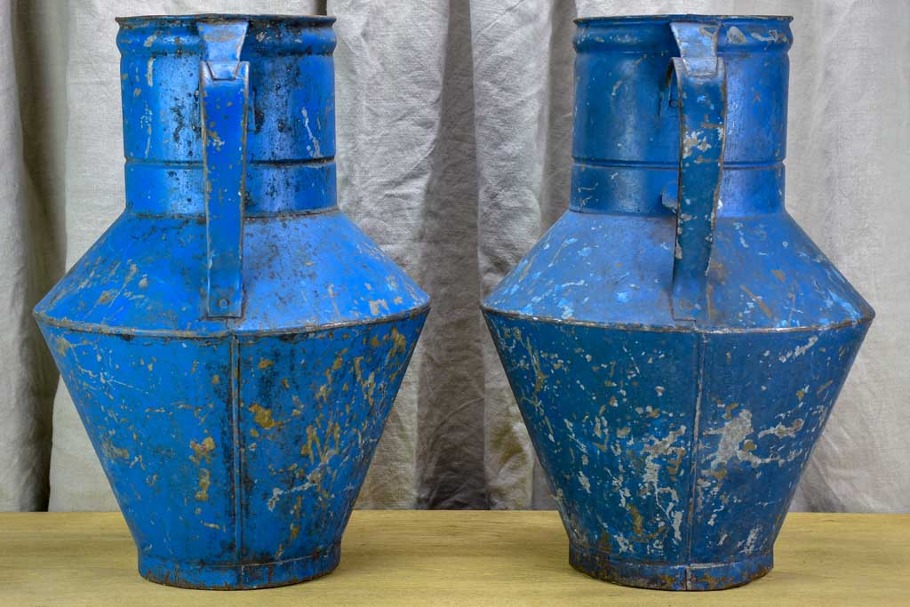 Pair of rustic blue agricultural vessels 20"