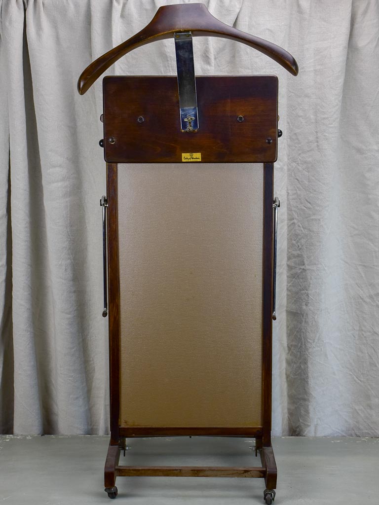 Stylish vintage suit rack on casters