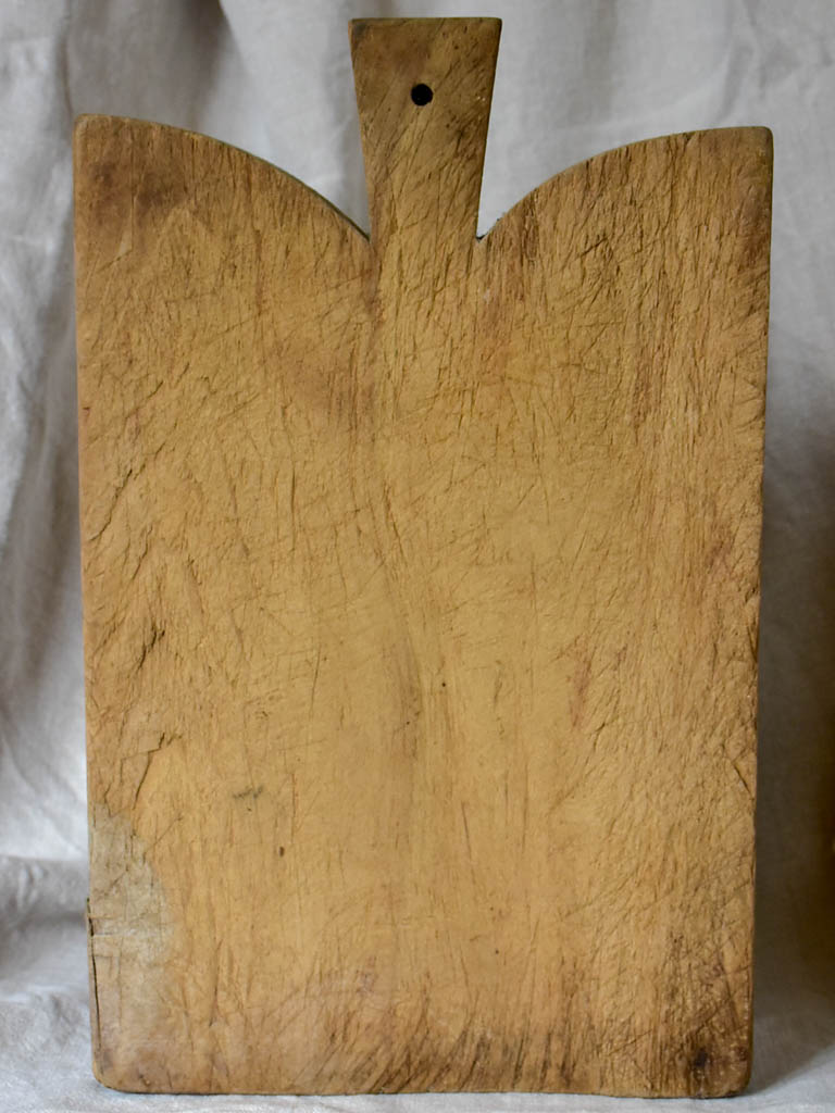 Antique French cutting board with curved peaked shoulders 16½"