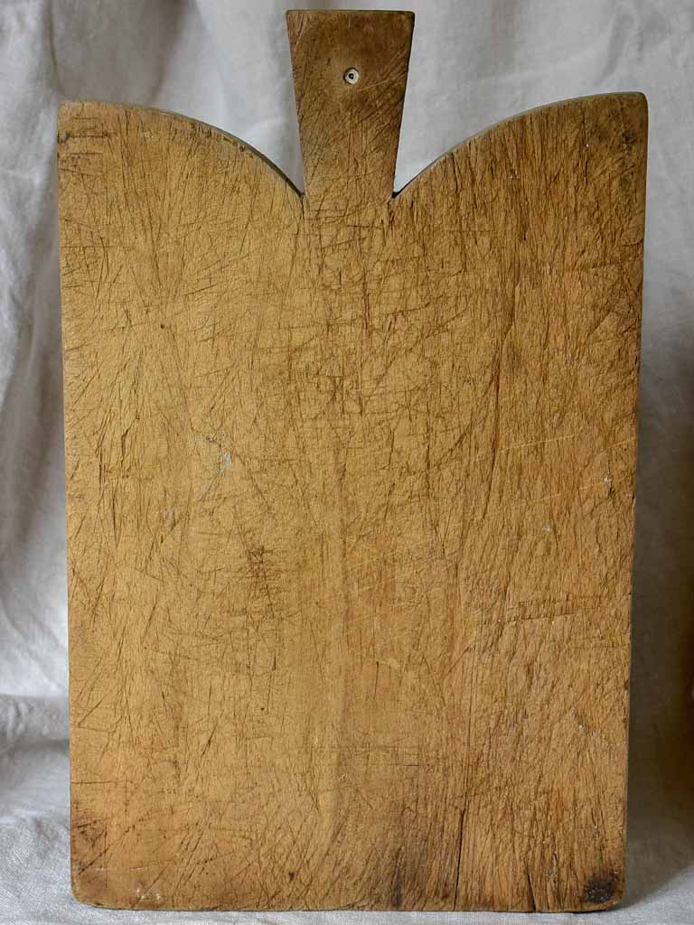 Antique French cutting board with curved peaked shoulders 16½"