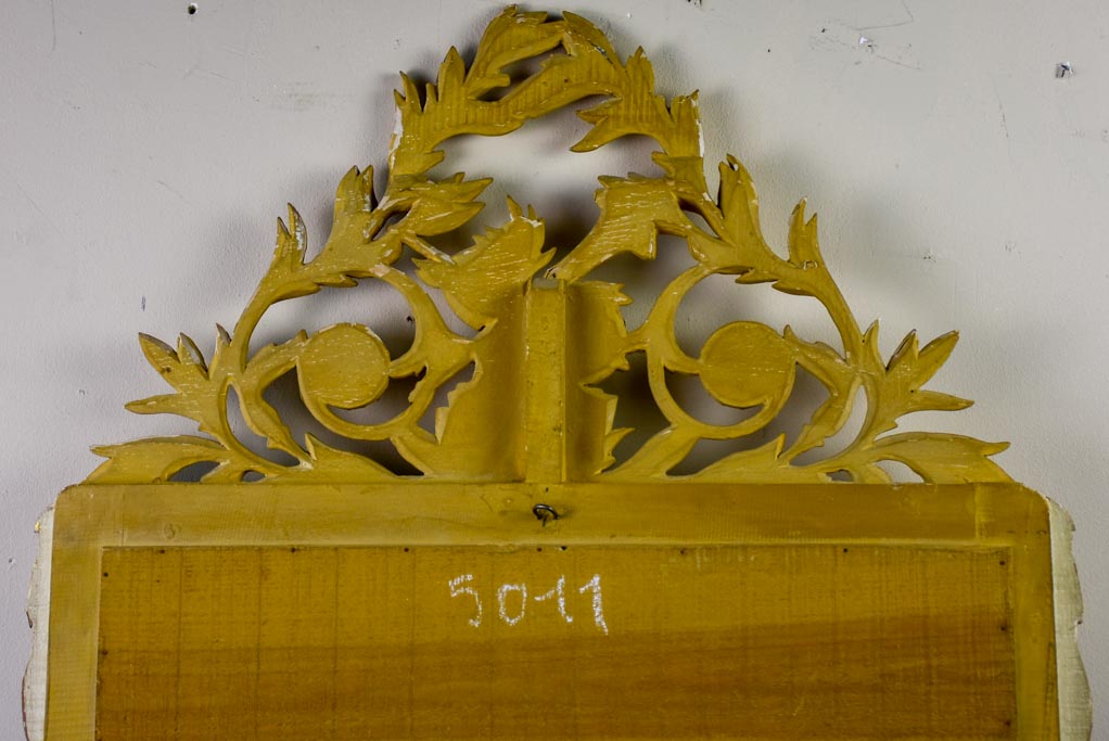Louis XVI-style gilded mirror with musical floral crest and motifs 26½" x 46¾"