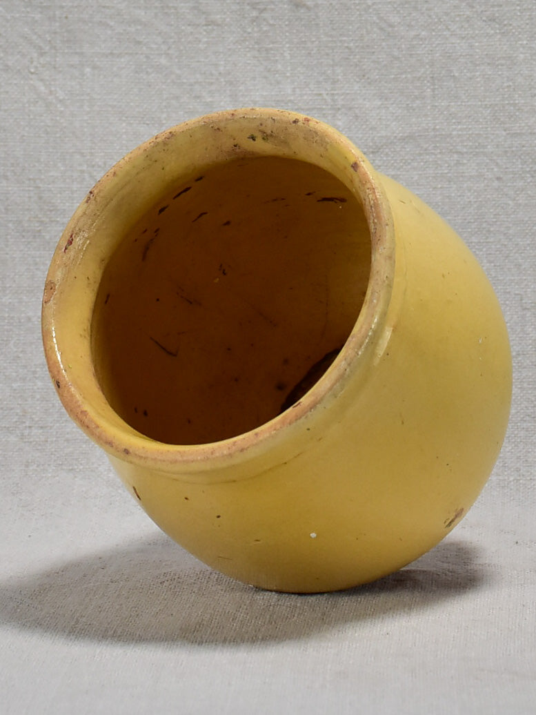 Antique French confit pot with no handles and yellow glaze 5"