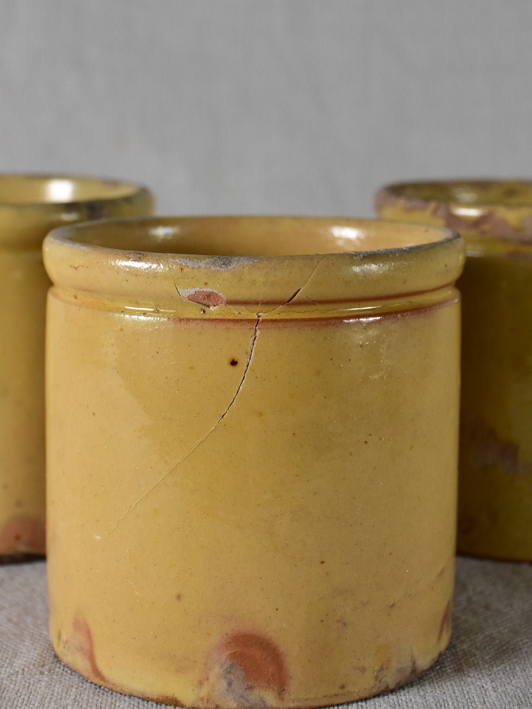 Three antique French yellow ware preserving jars 3½"
