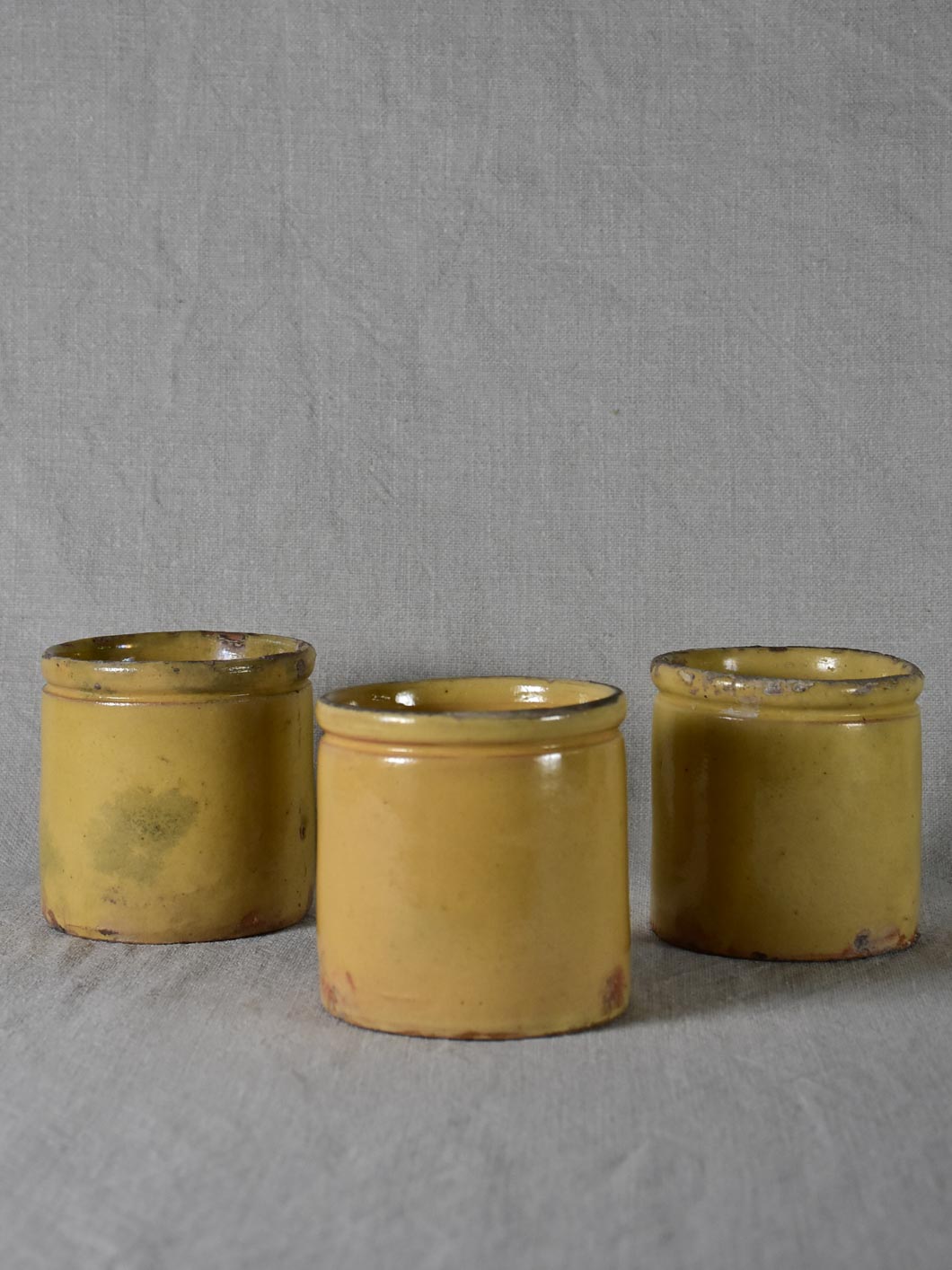 Three antique French yellow ware preserving jars 3½"