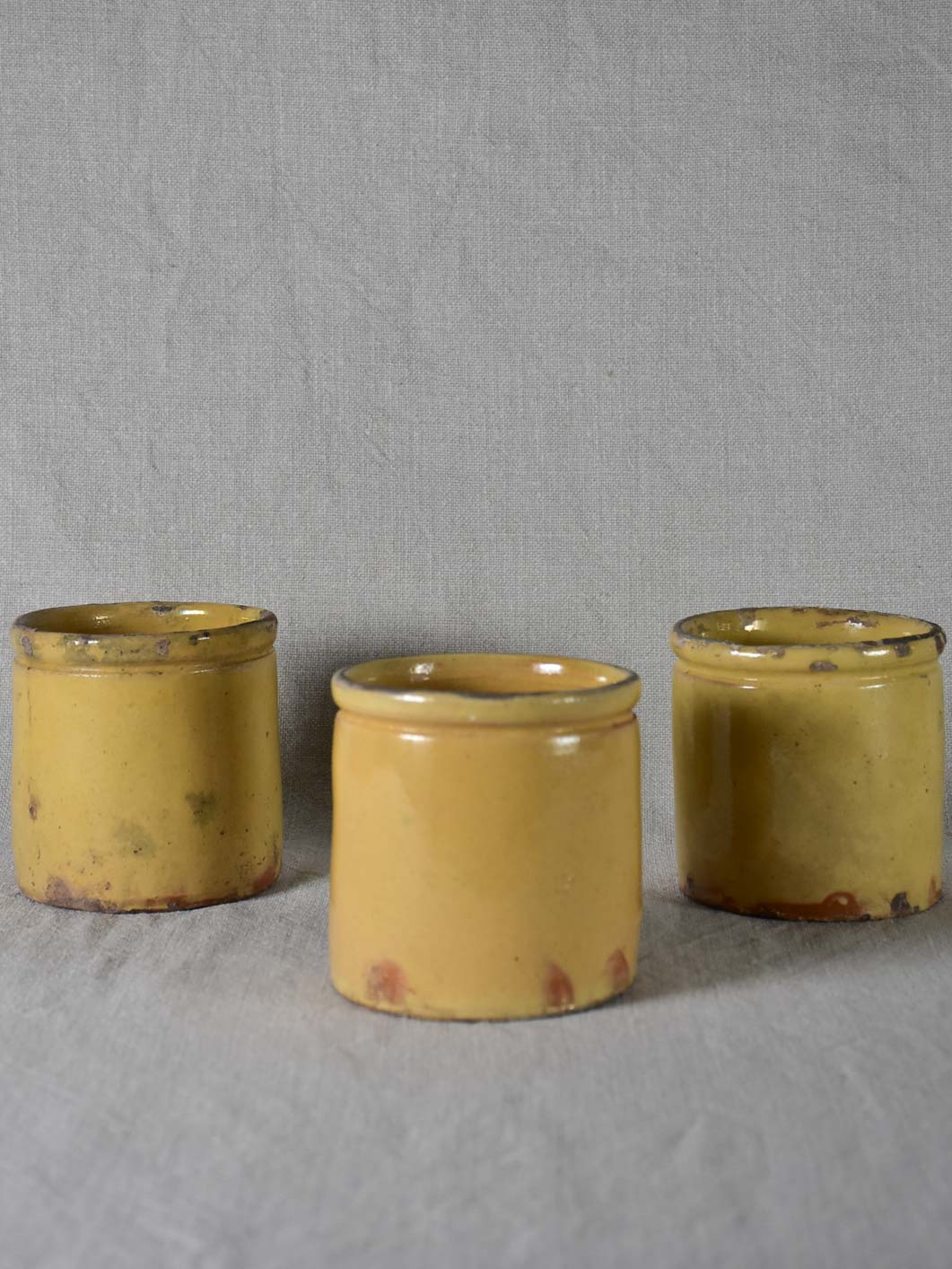 Three antique French yellow ware preserving jars 3½"