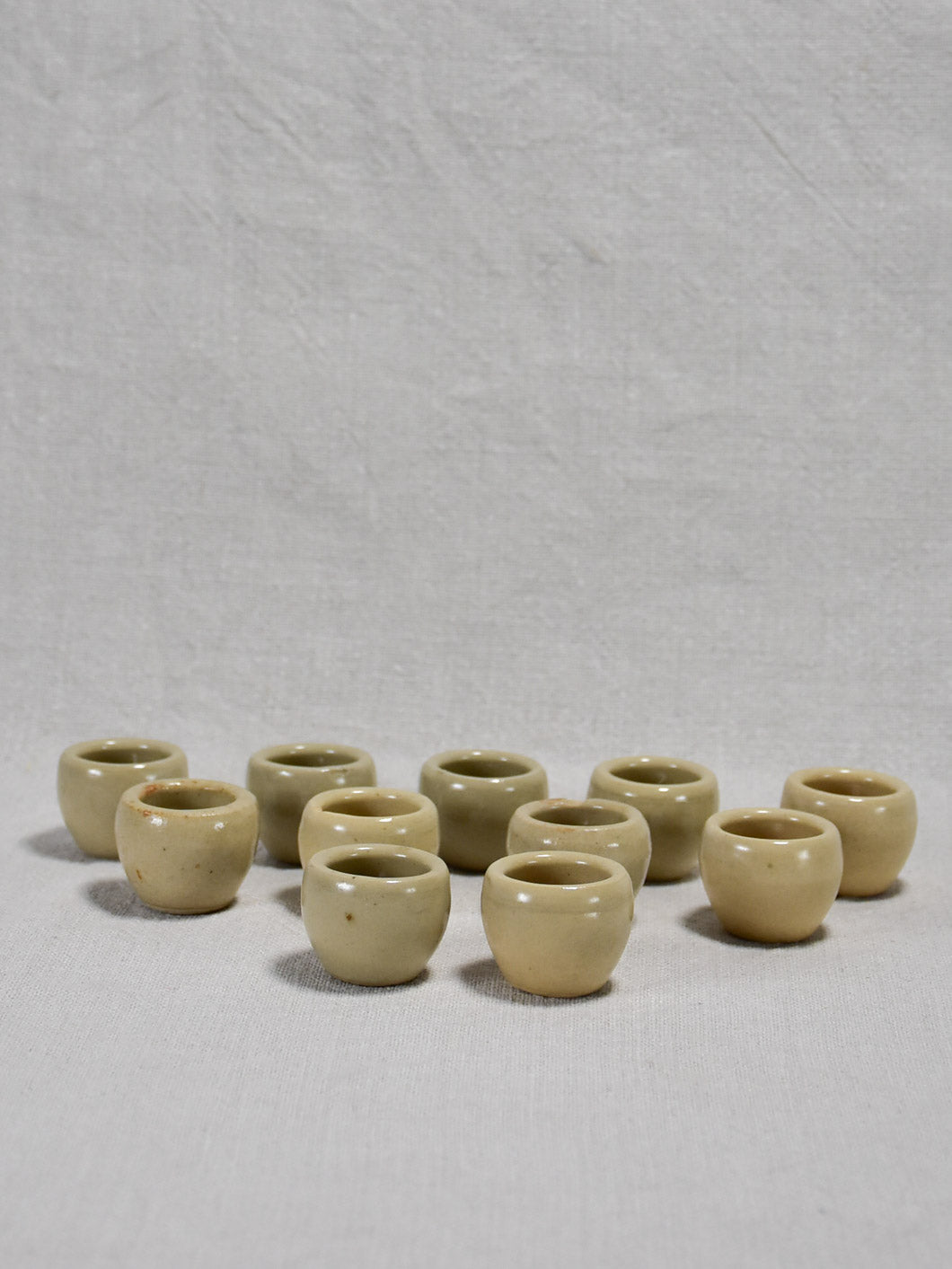 Collection of ten vintage snail pots from Burgundy - gray / beige glaze 1¼"