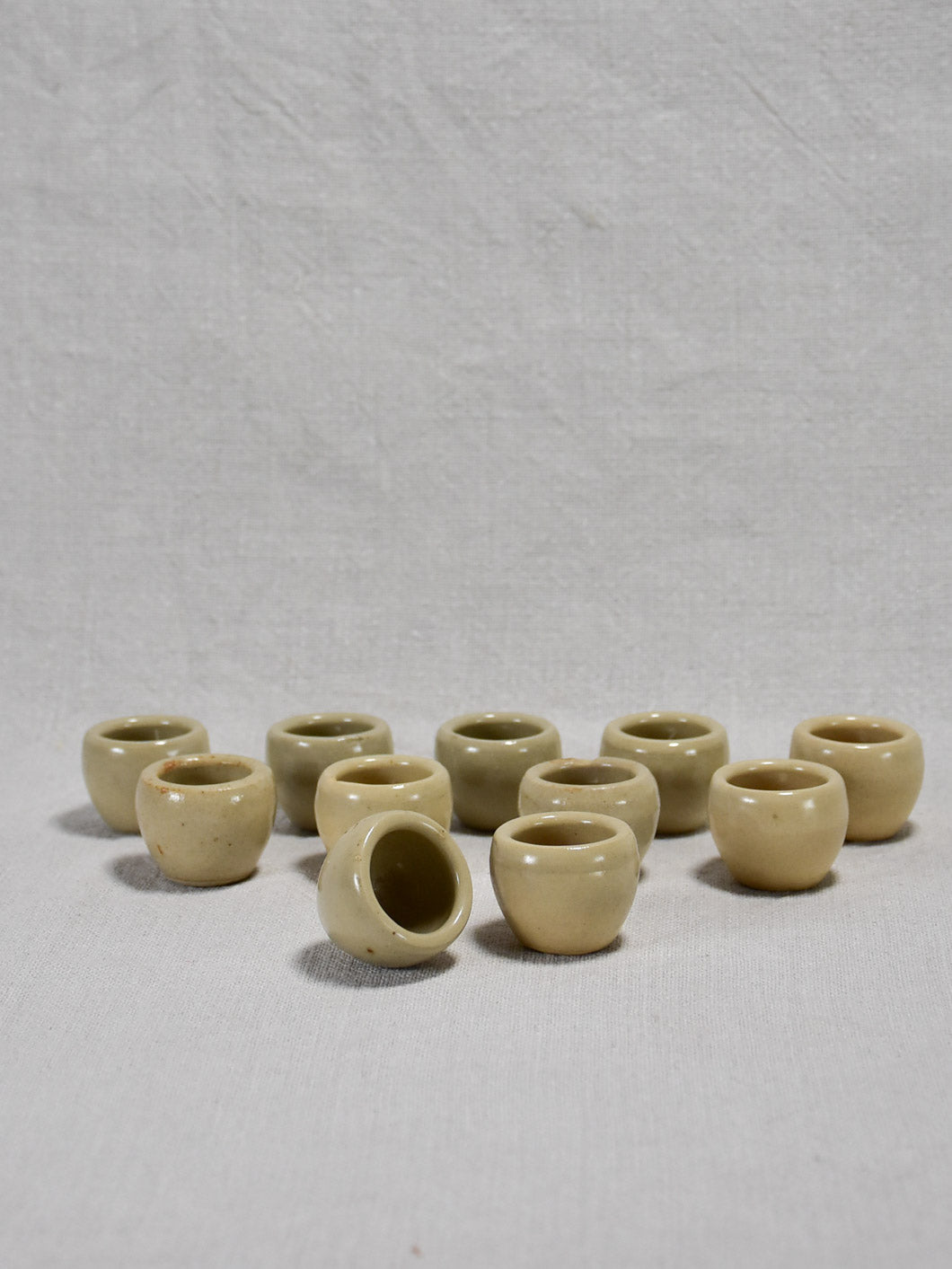 Collection of ten vintage snail pots from Burgundy - gray / beige glaze 1¼"