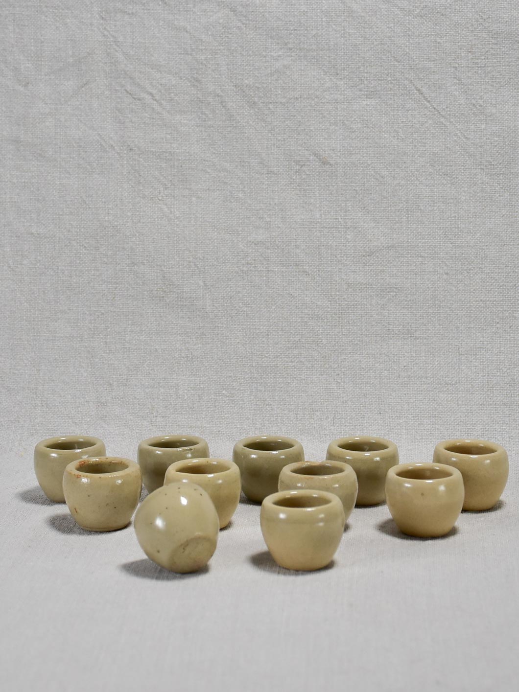 Collection of ten vintage snail pots from Burgundy - gray / beige glaze 1¼"
