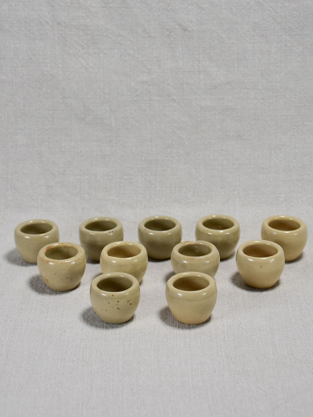 Collection of ten vintage snail pots from Burgundy - gray / beige glaze 1¼"