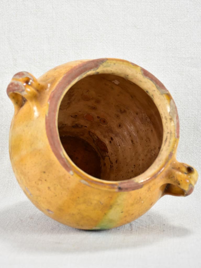 Round antique French confit pot with yellow glaze and green spot 8¼"