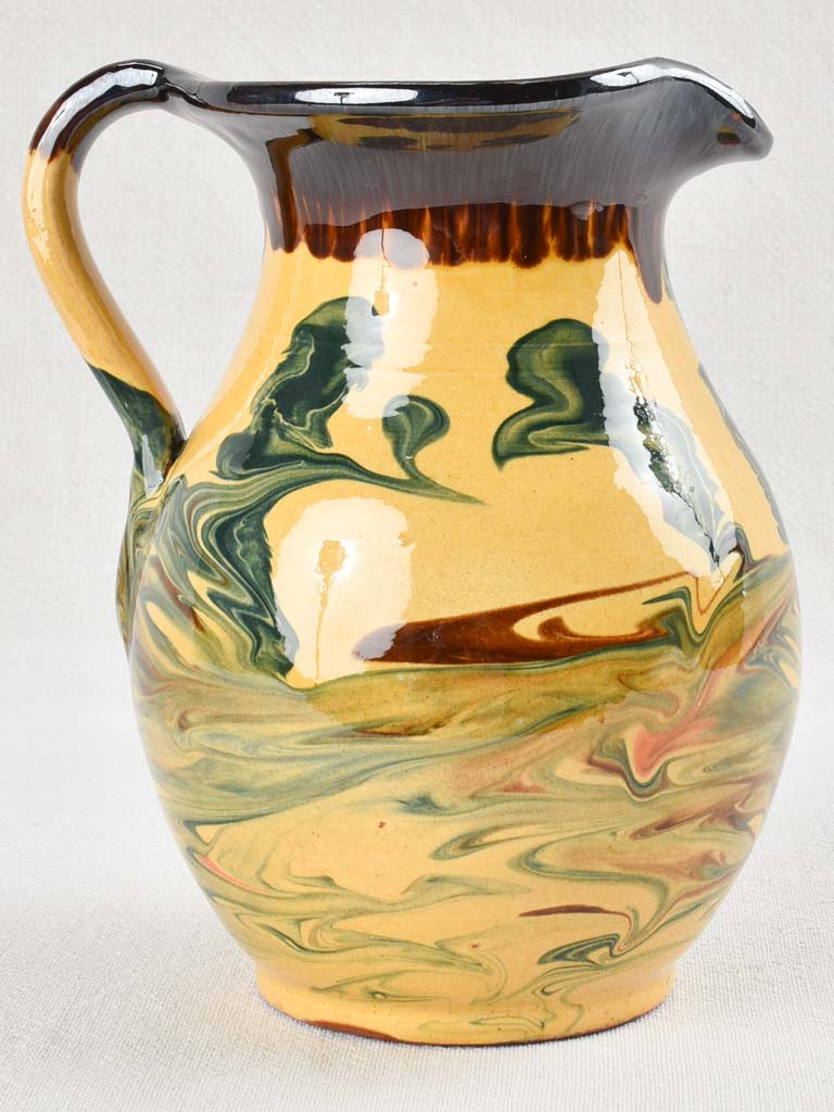 Vintage terracotta pitcher with colorful glaze 8¾"