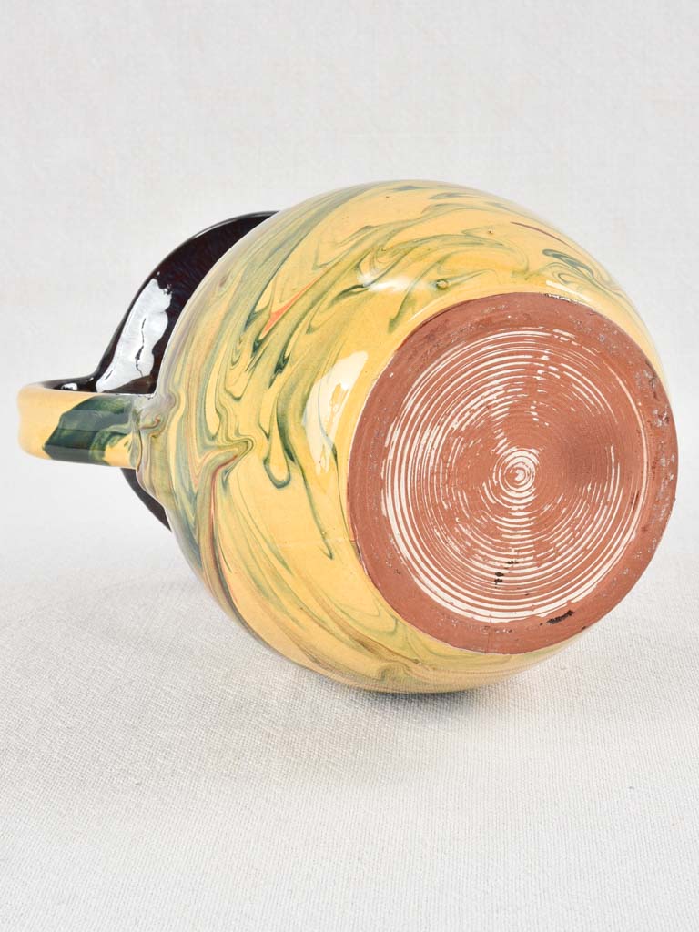 Vintage terracotta pitcher with colorful glaze 8¾"
