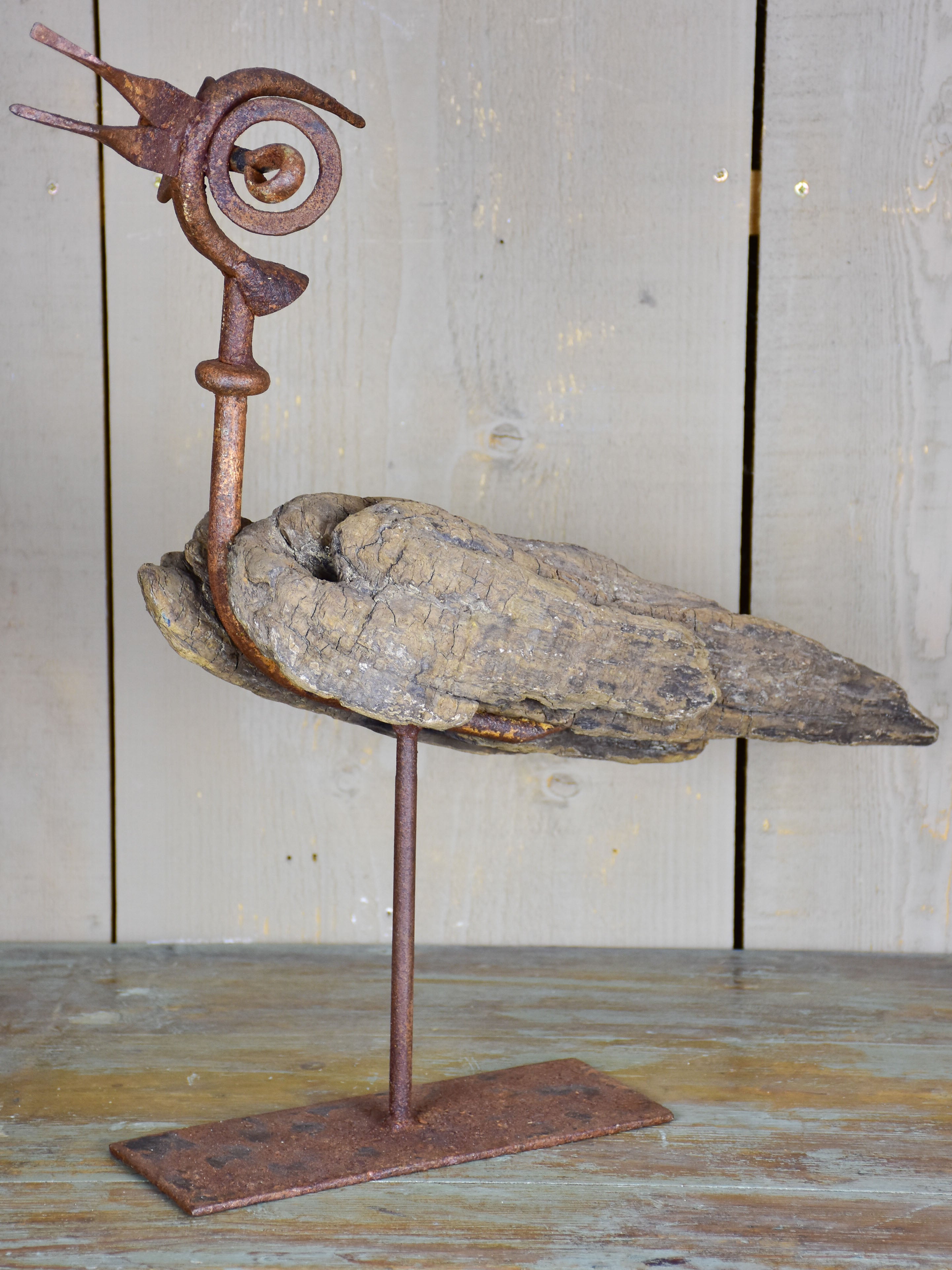 Bird sculpture made from salvaged driftwood and wrought iron