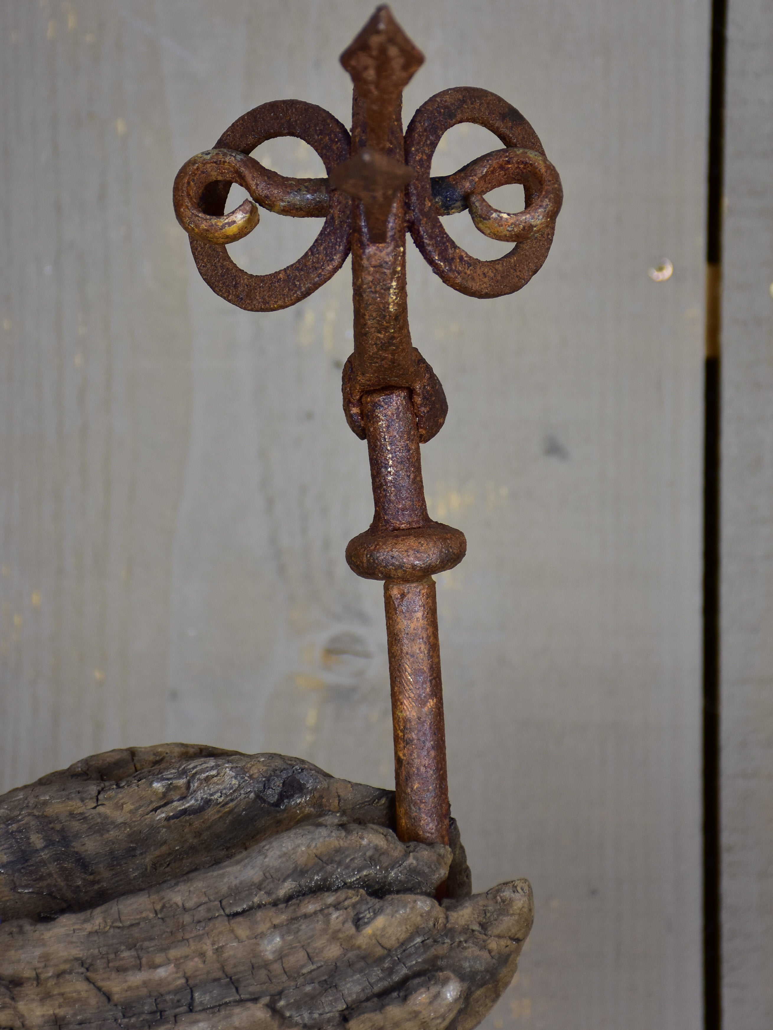 Bird sculpture made from salvaged driftwood and wrought iron