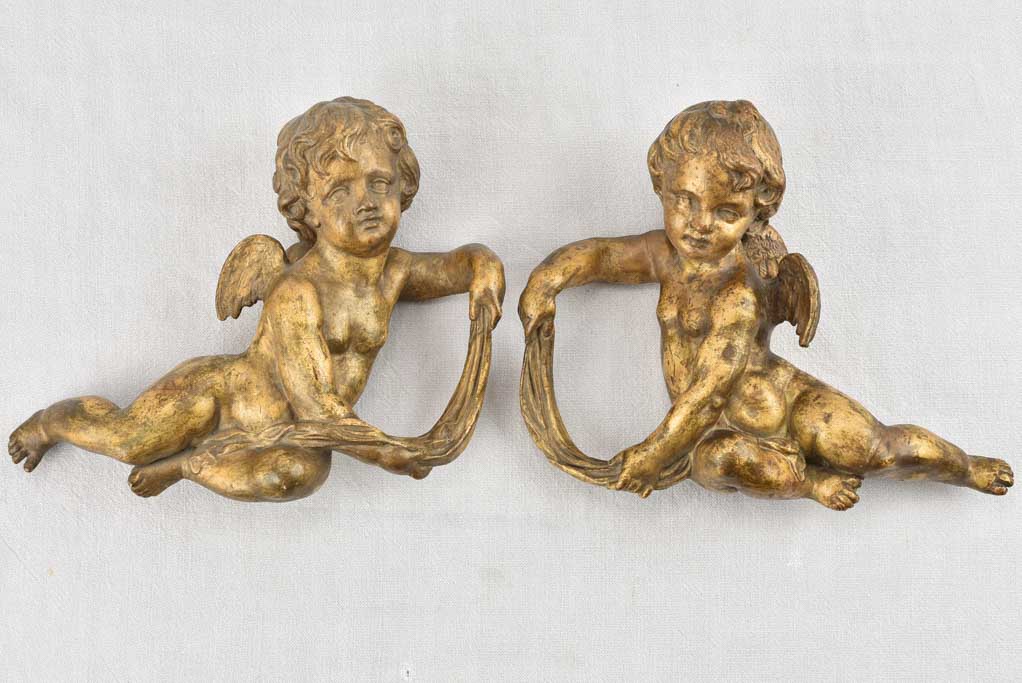 Rustic 19th-century angel wall sculptures