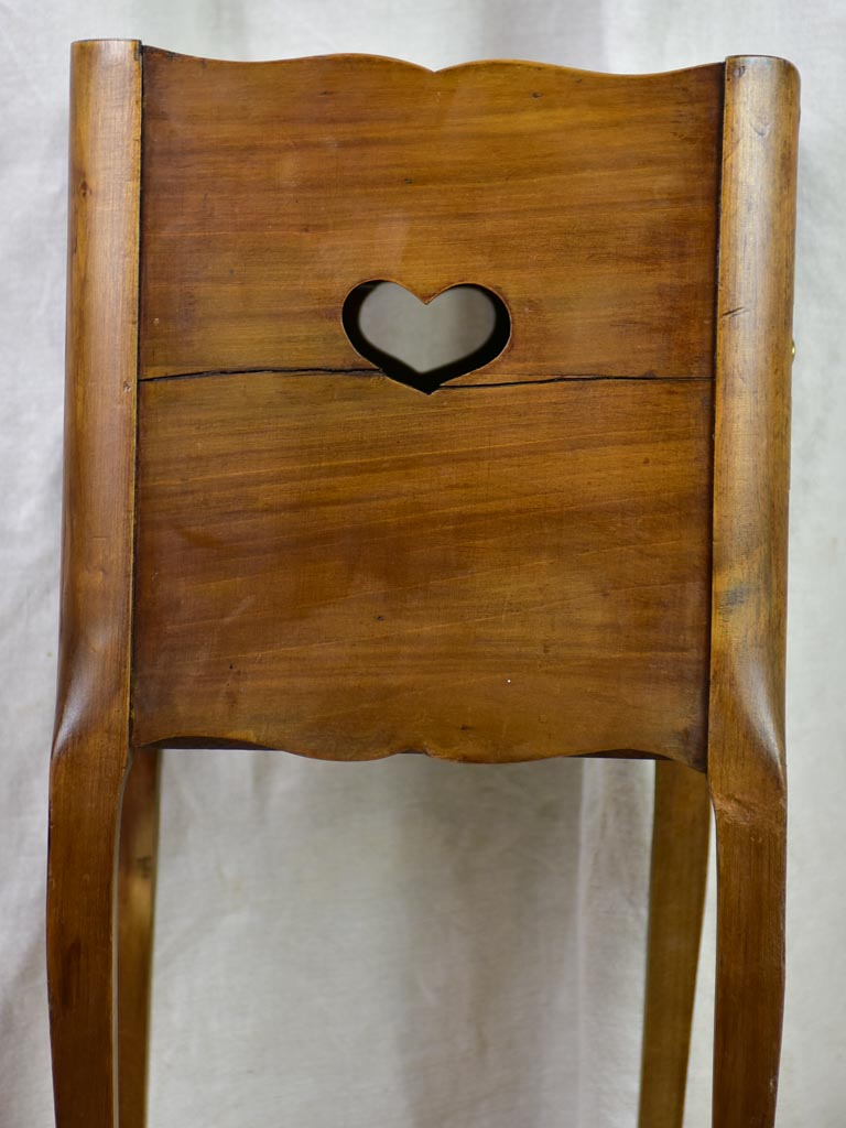 Antique French nightstand with ribbed doors and heart shaped cut out
