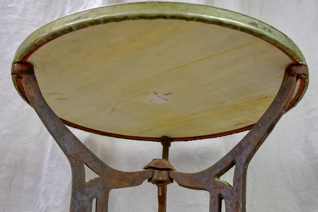 Antique French bistro table with marble top and cast iron base