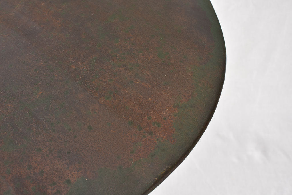 Claw foot round garden table with green patina
