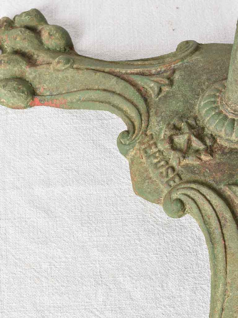Claw foot round garden table with green patina