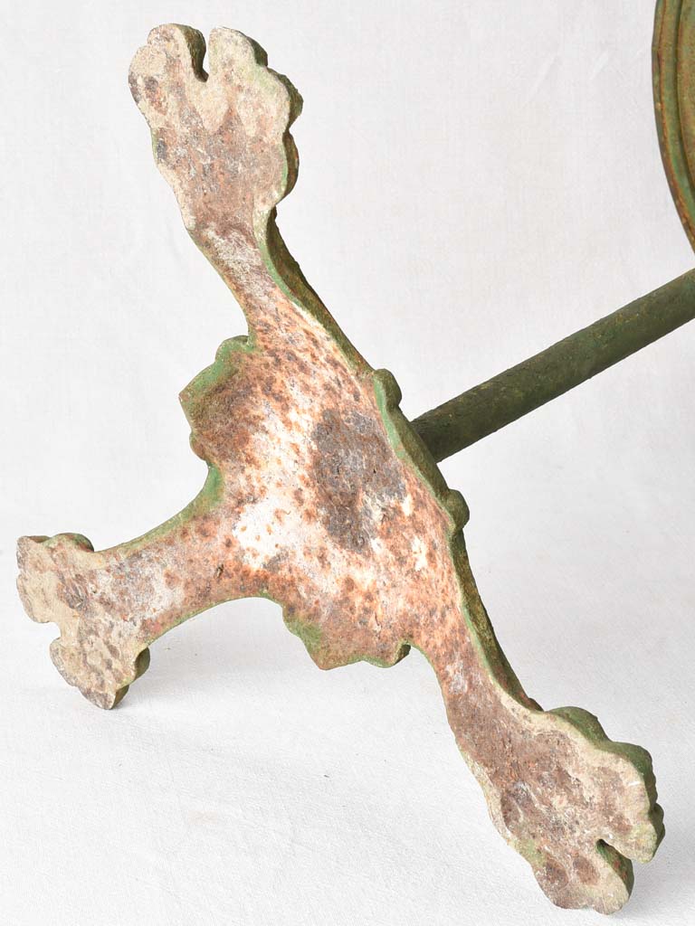 Claw foot round garden table with green patina
