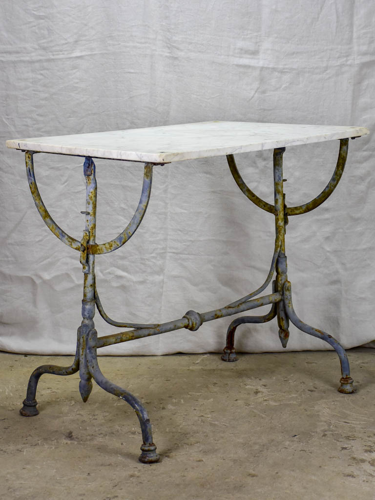 Small 19th Century rectangular garden table with marble top and blue iron base 22¾" x 32¼"