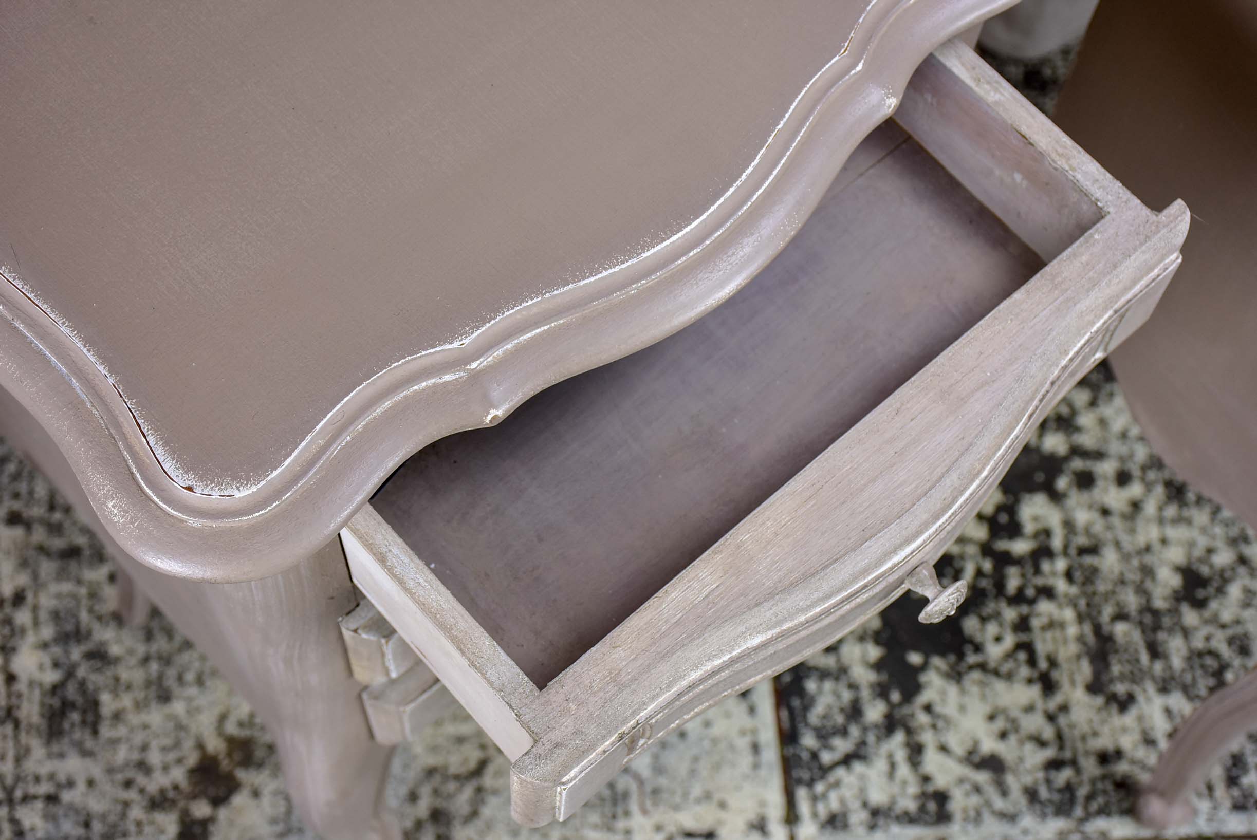 A pair of French Louis XV style nightstands with painted finish