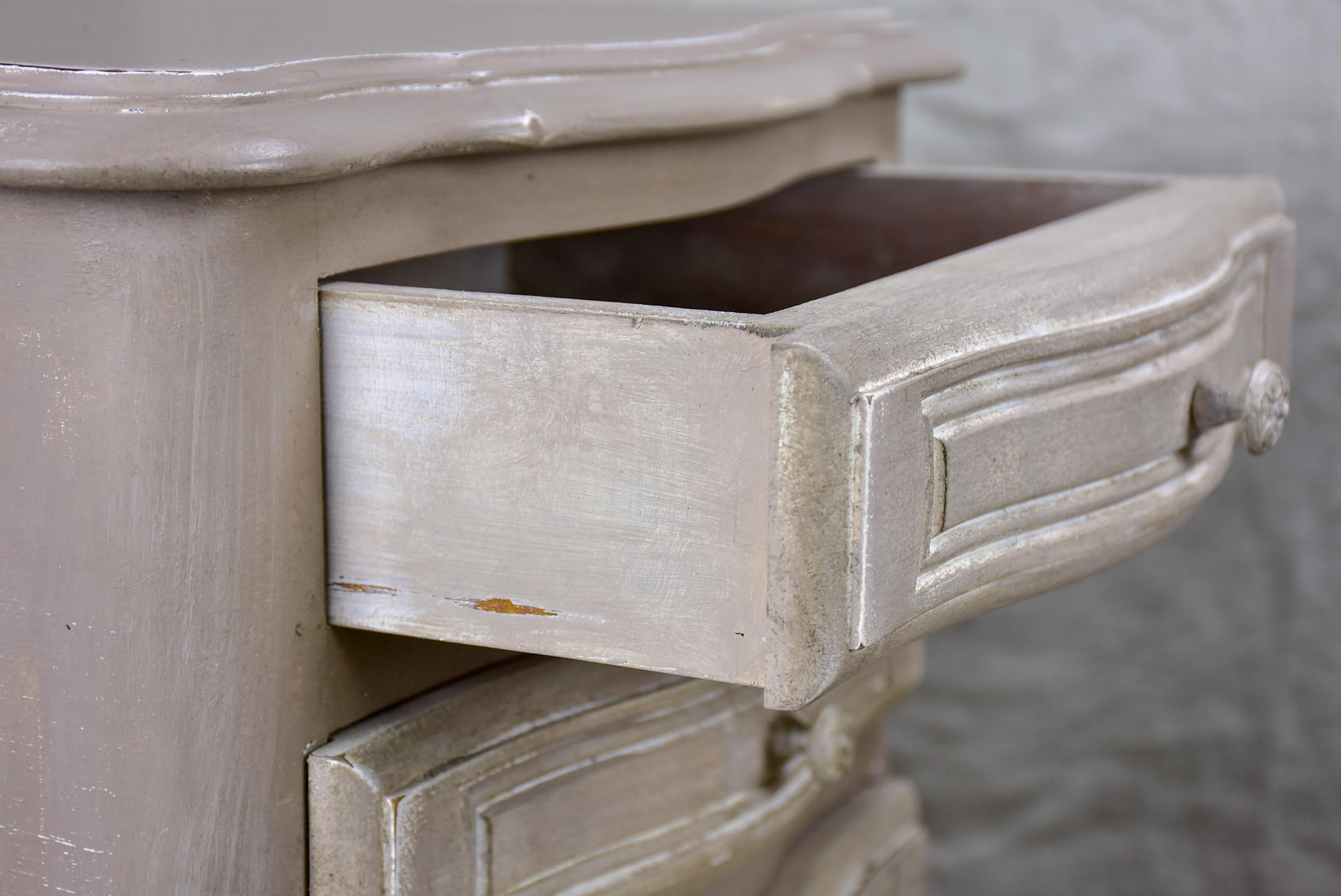 A pair of French Louis XV style nightstands with painted finish