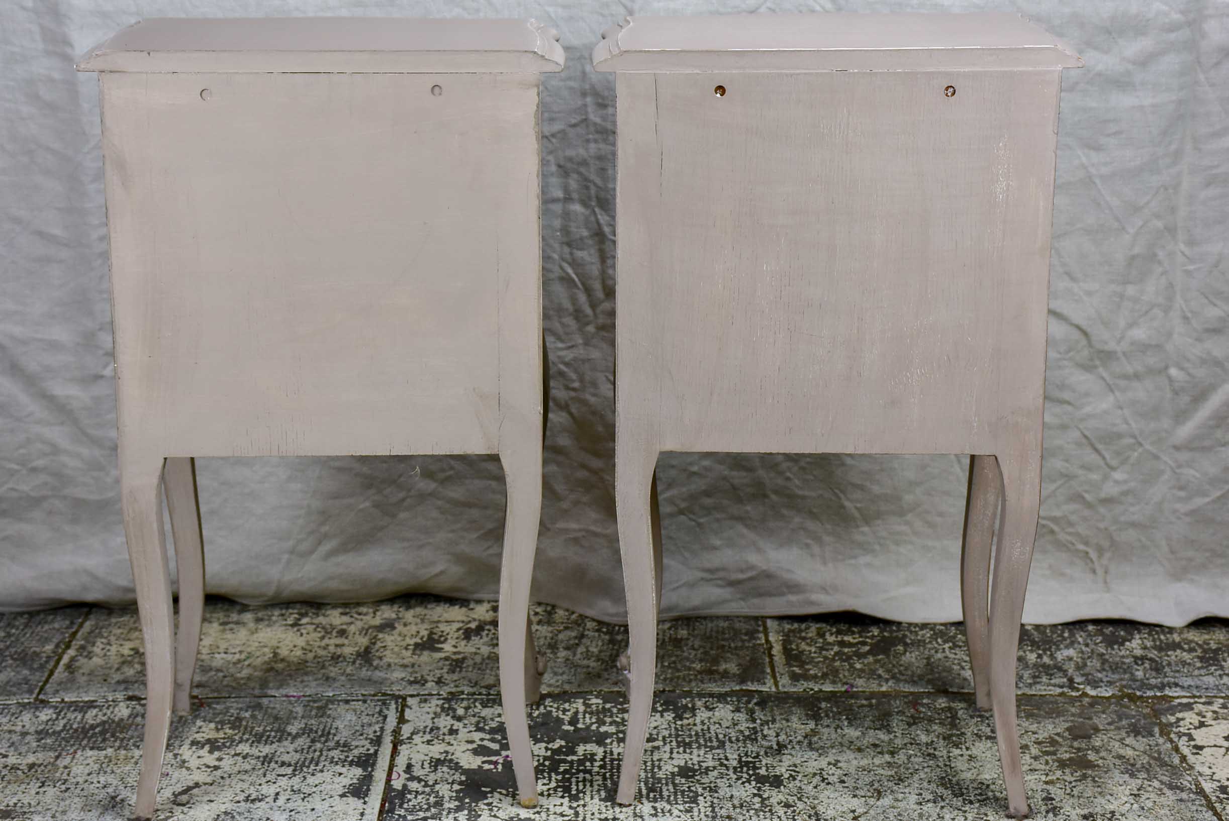 A pair of French Louis XV style nightstands with painted finish
