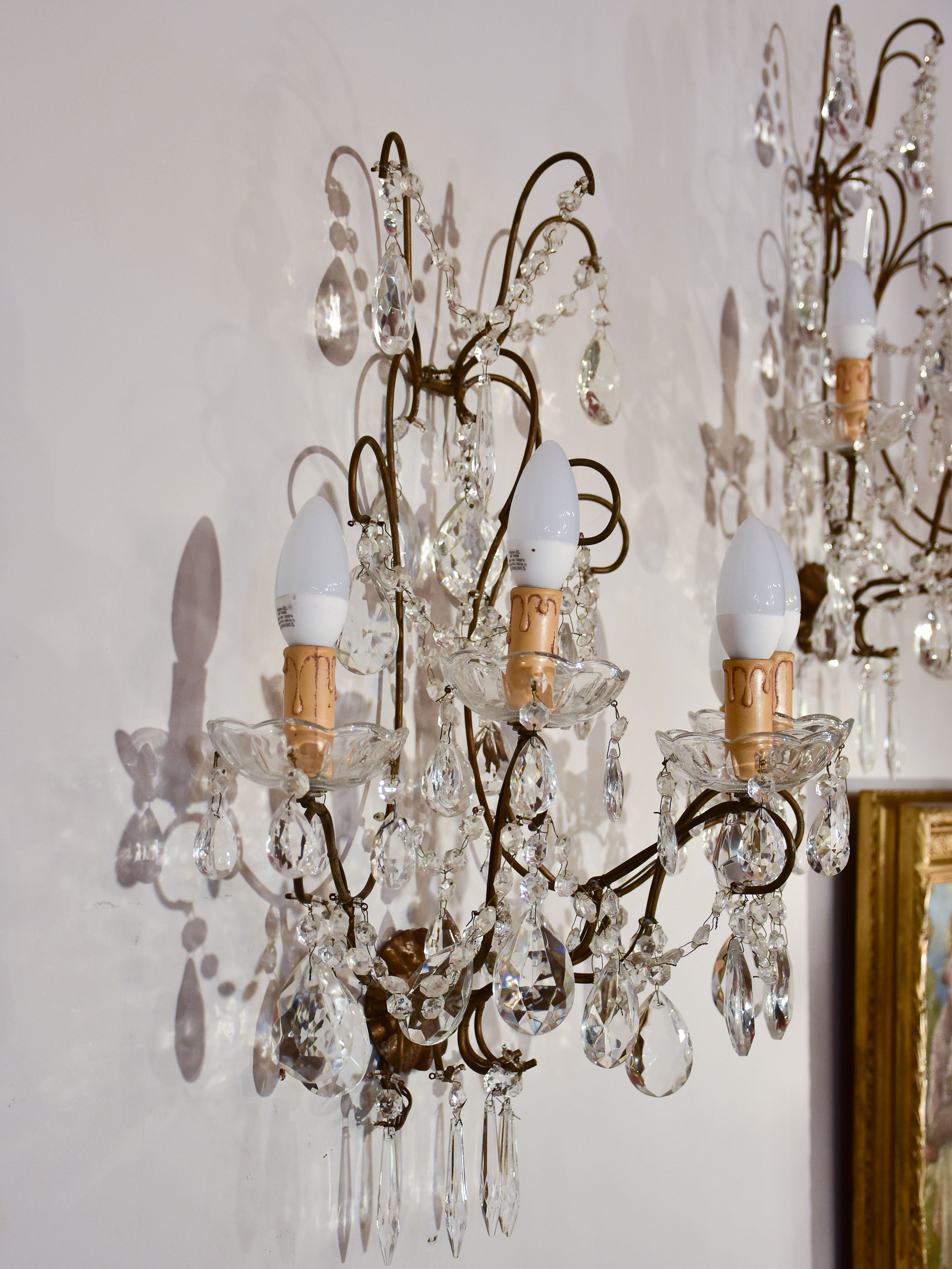 Set of four antique crystal wall sconces