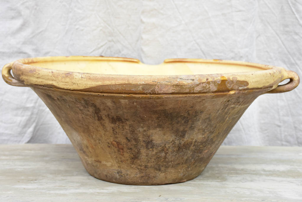 Large antique French tian bowl with yellow glaze, two handles and beak - 20¾ diameter"