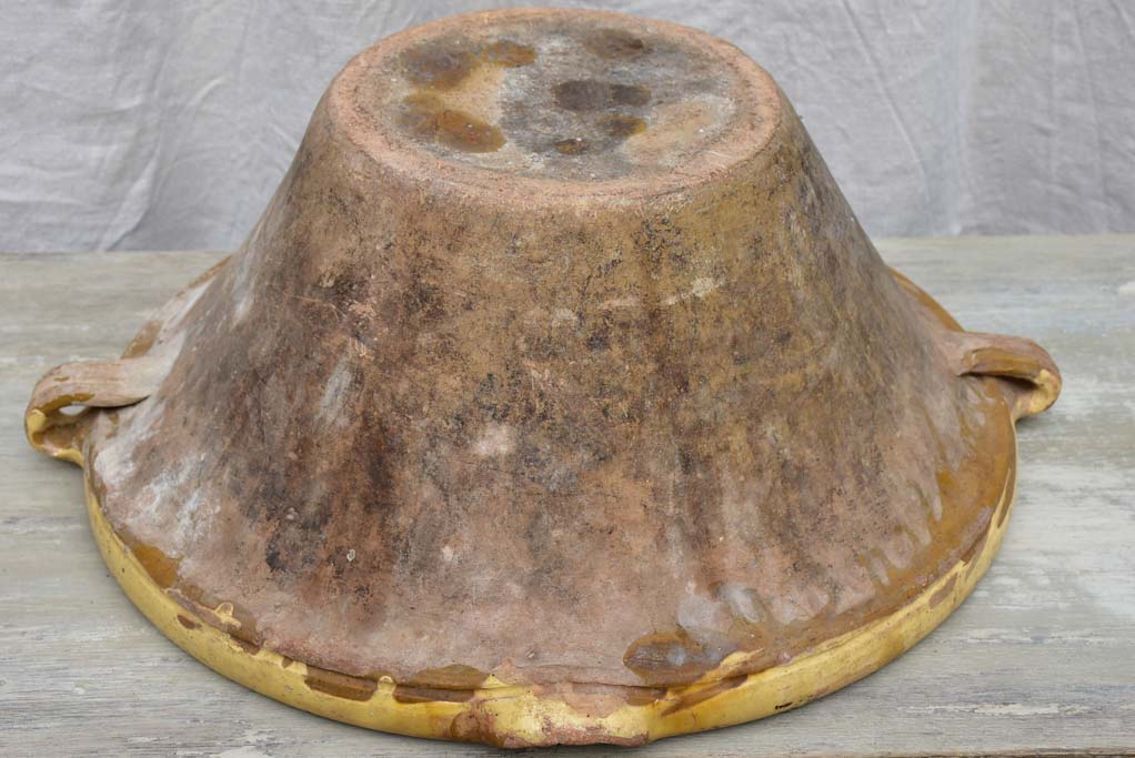 Large antique French tian bowl with yellow glaze, two handles and beak - 20¾ diameter"