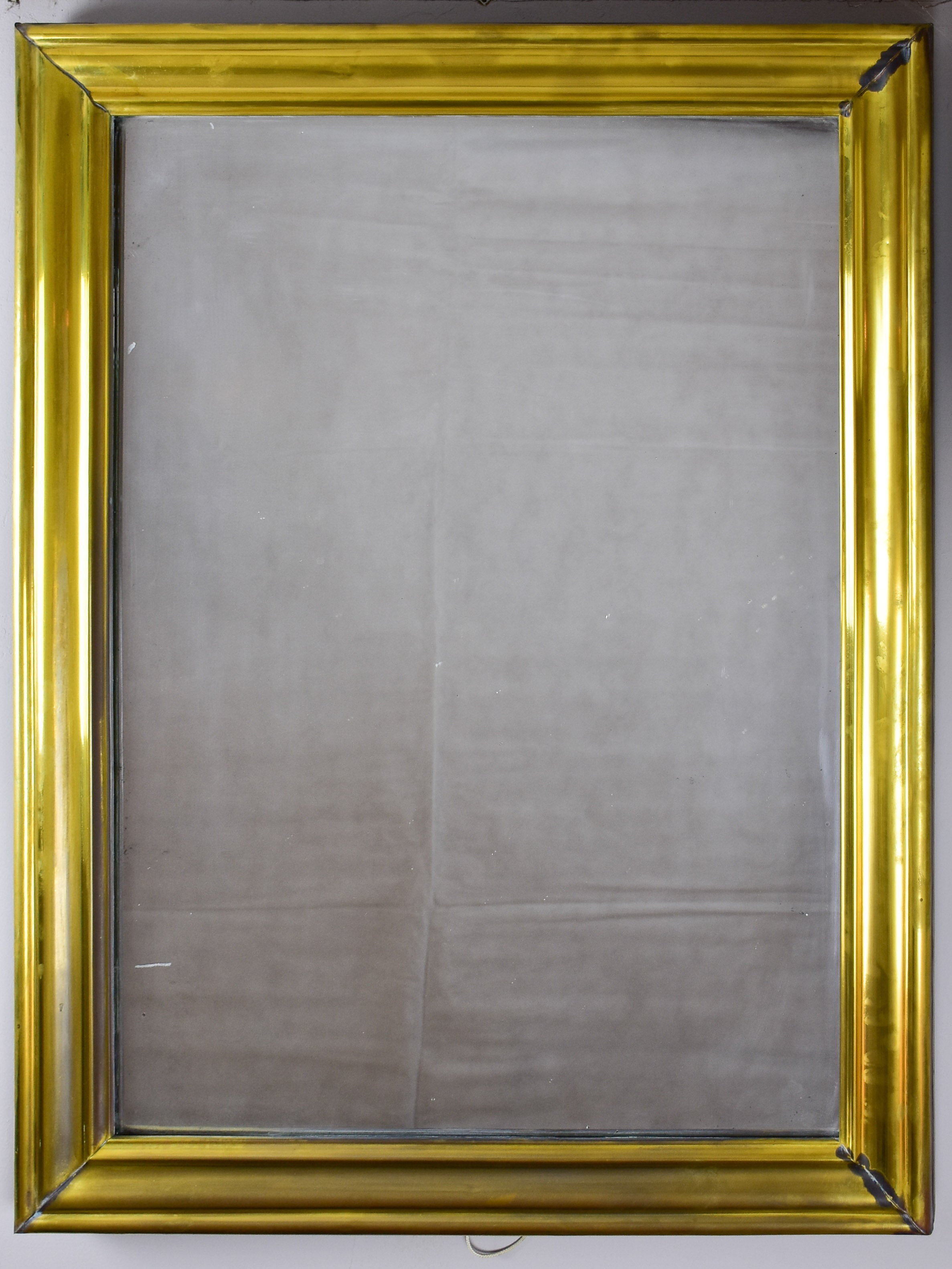 Antique French bistro mirror with brass frame
