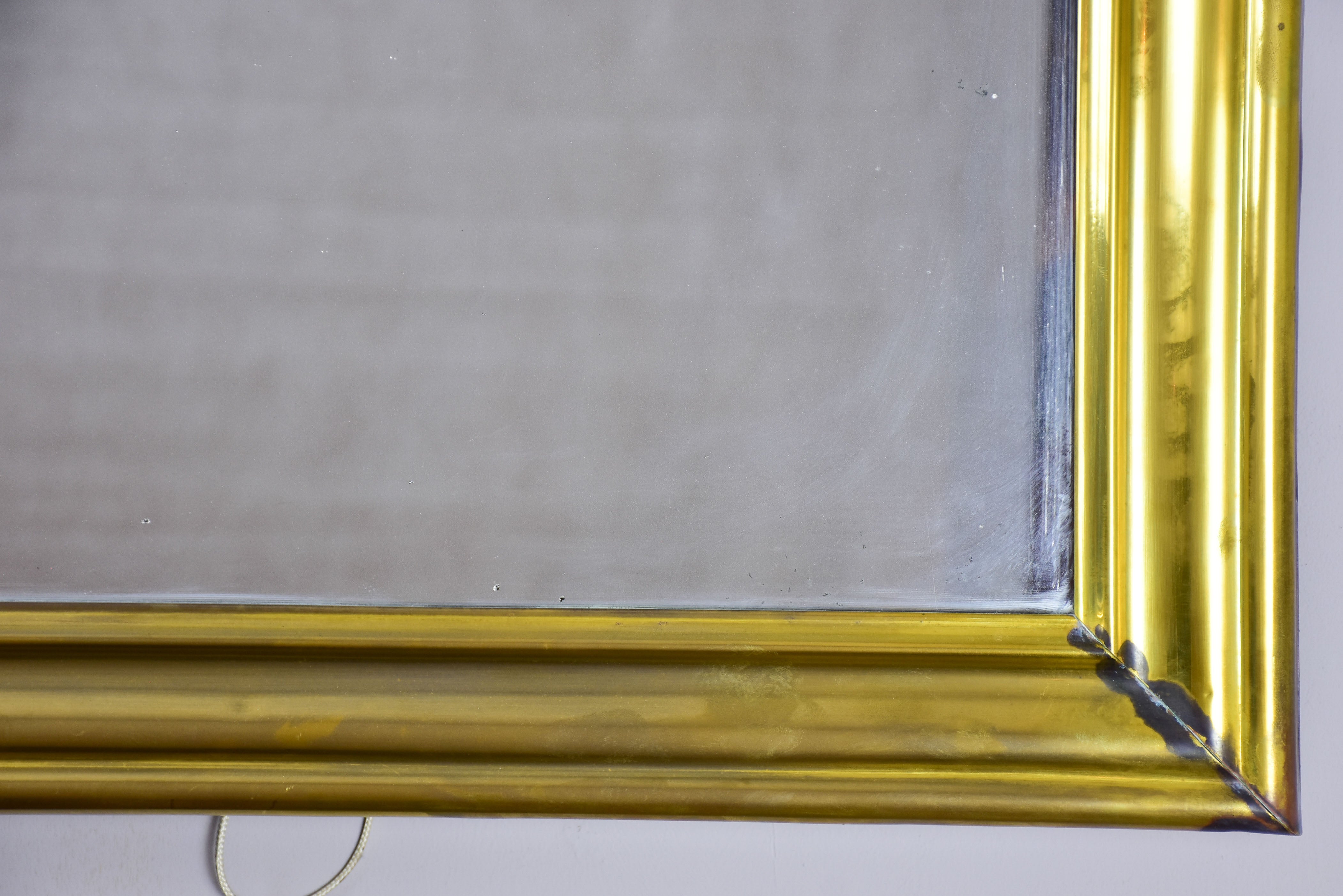 Antique French bistro mirror with brass frame