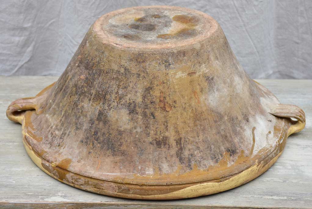 Large antique French tian bowl with yellow glaze, two handles and beak - 20¾ diameter"