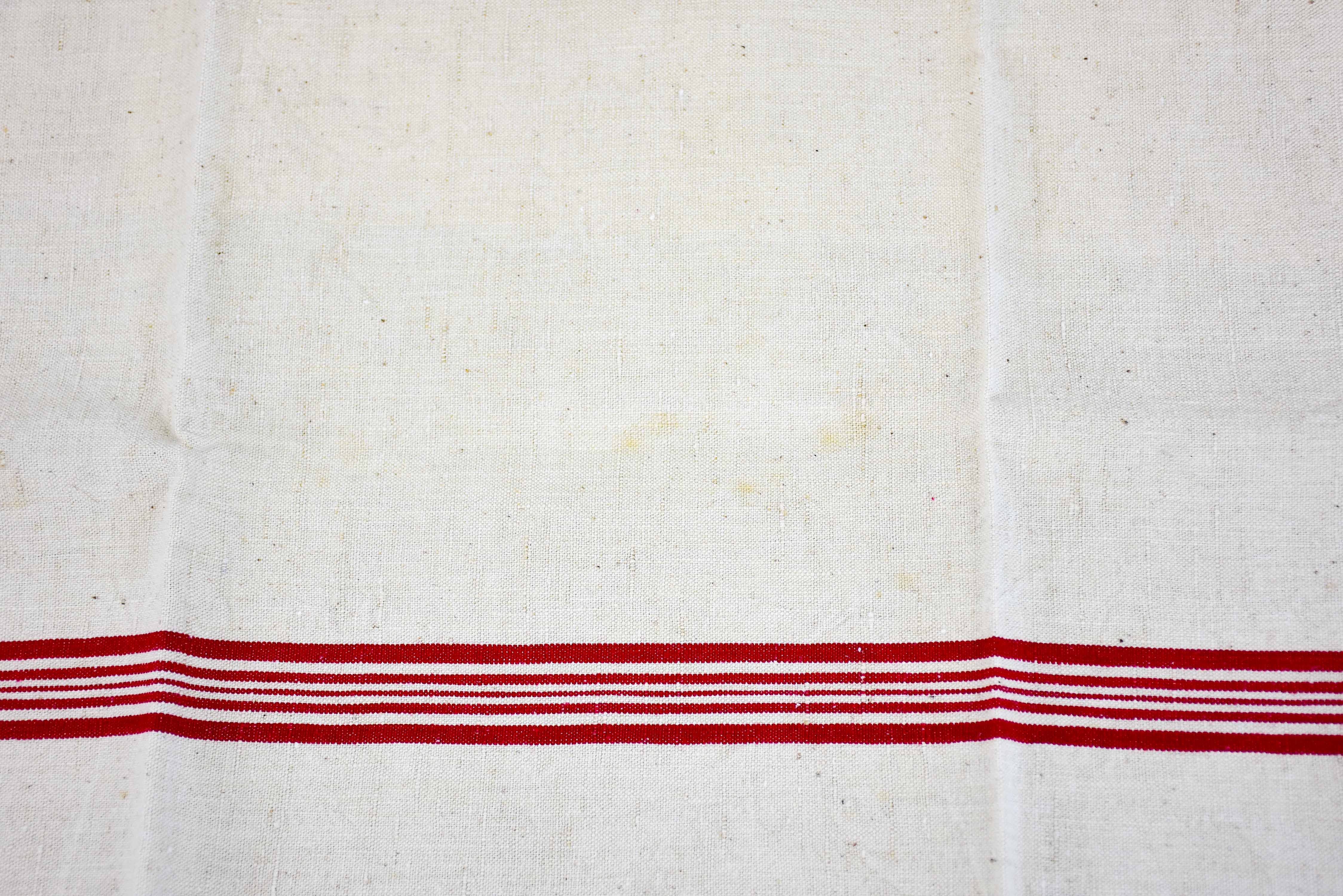 Four vintage French tea towels with AM monogram