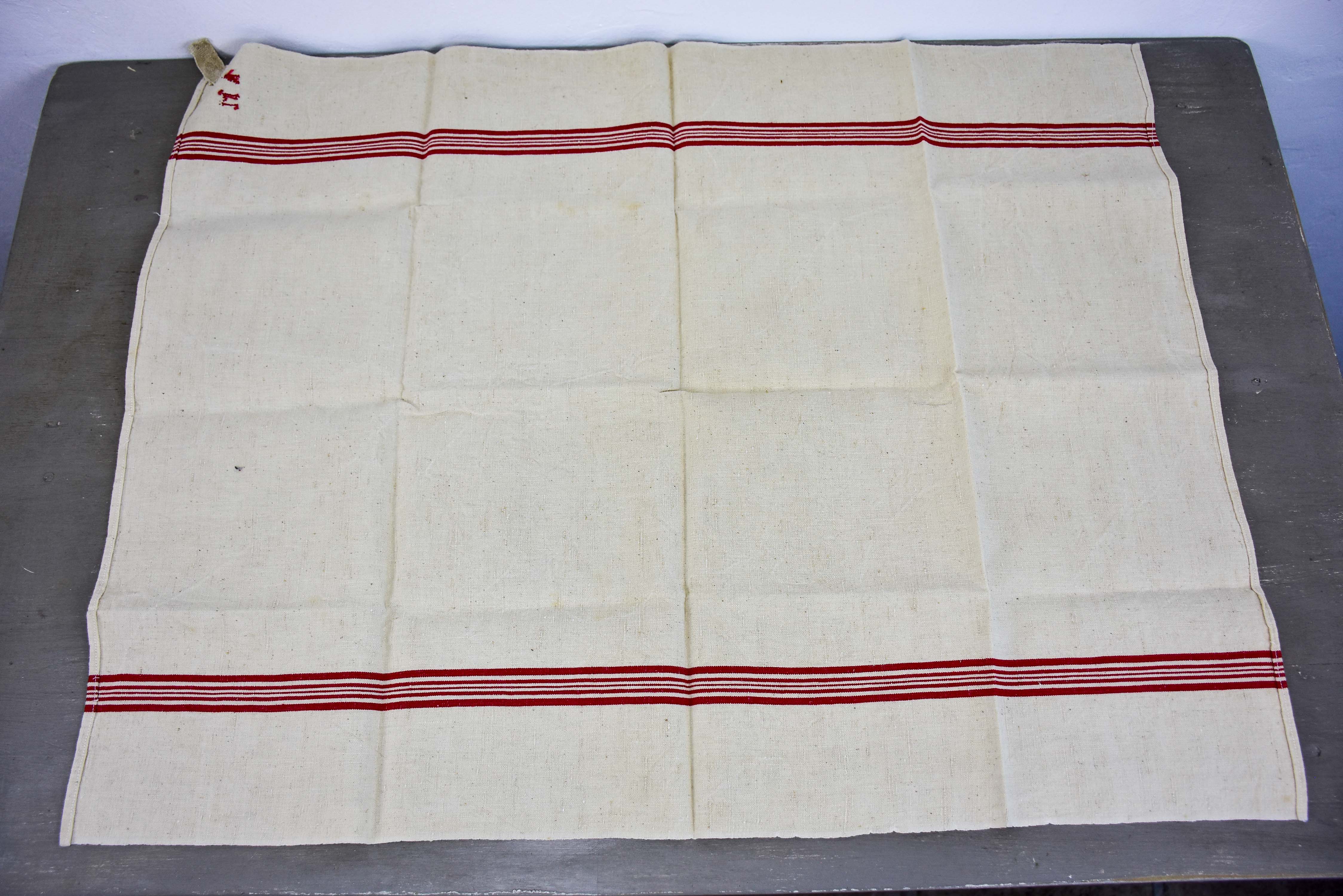 Four vintage French tea towels with AM monogram