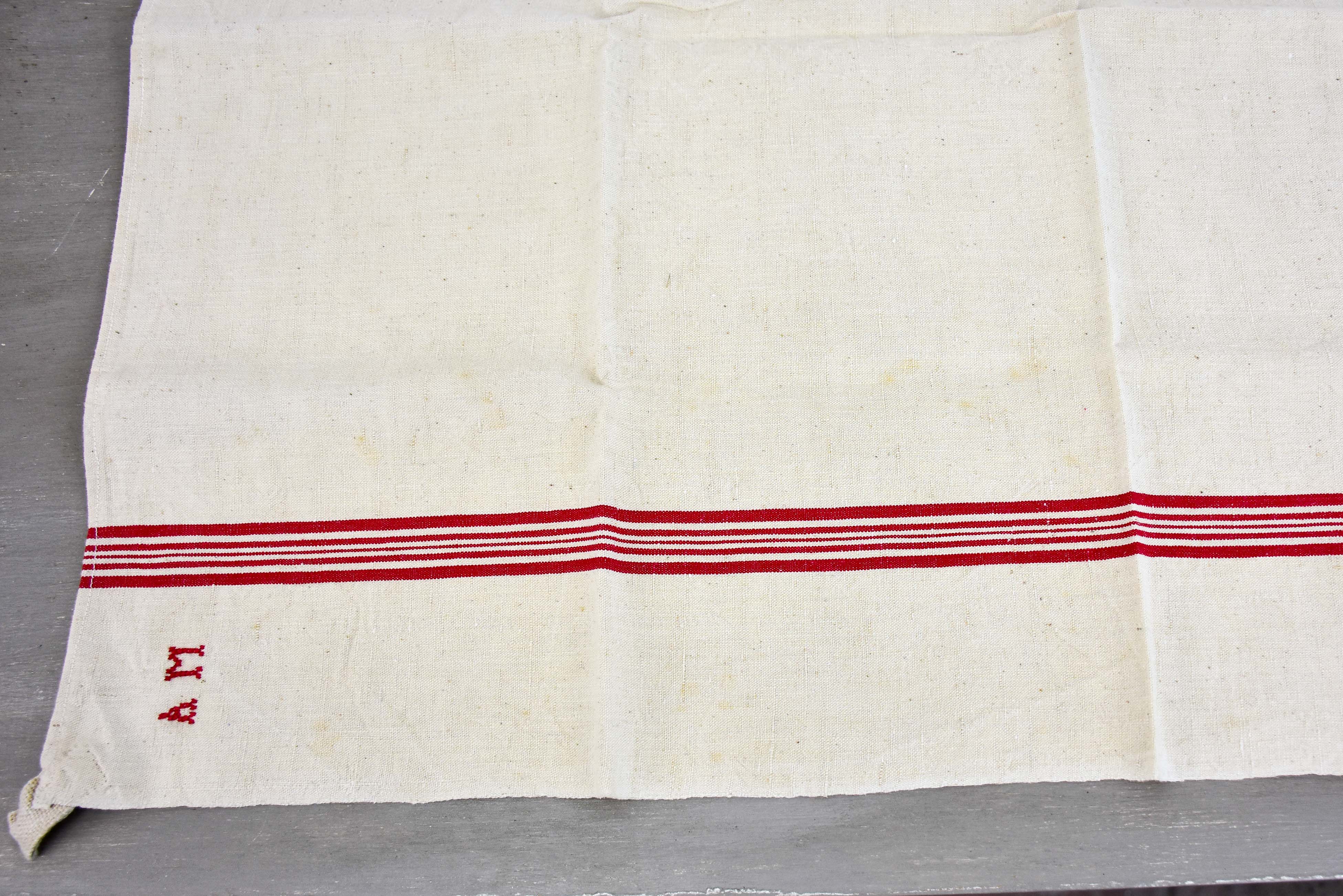 Four vintage French tea towels with AM monogram