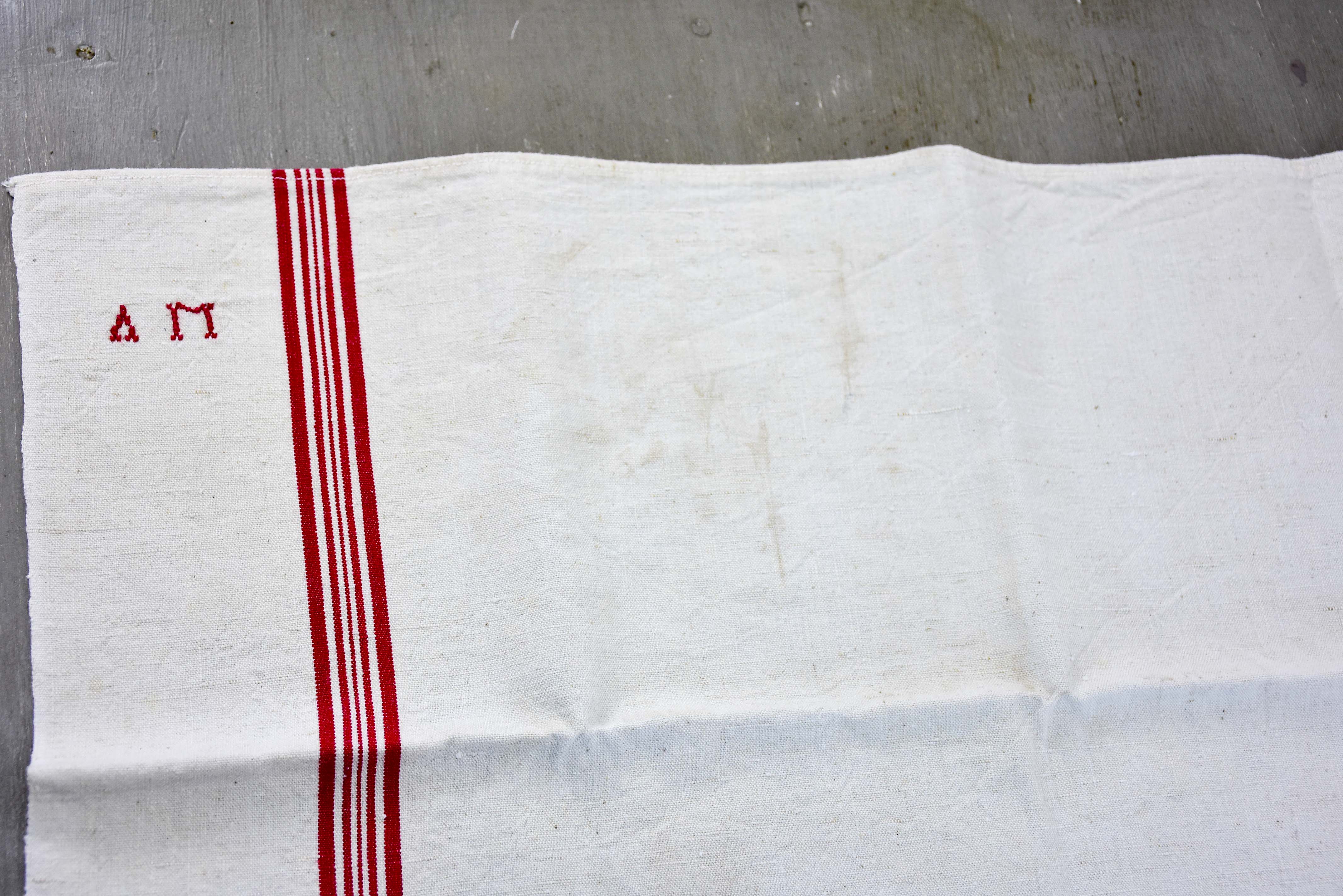 Four vintage French tea towels with AM monogram
